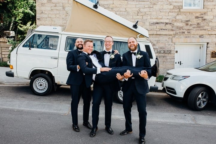 Bright-Clear-Groomsmen-Photo-Ideas-Holding-Groom