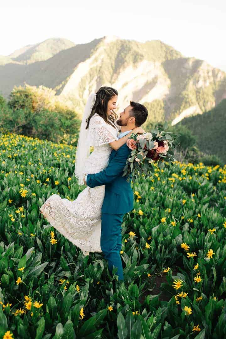 Groom-Lifts-Bride-Sunset-Utah-Mountains