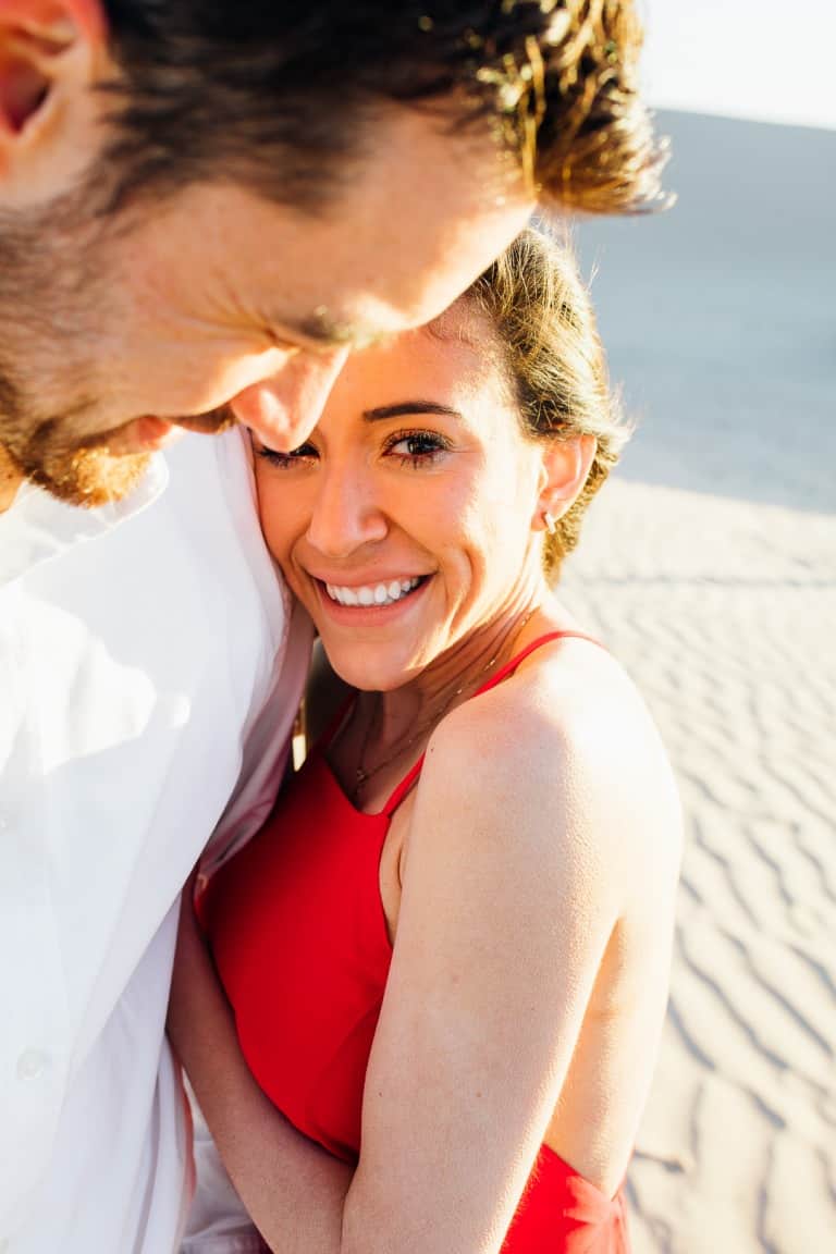 Golden hour engagements in sand