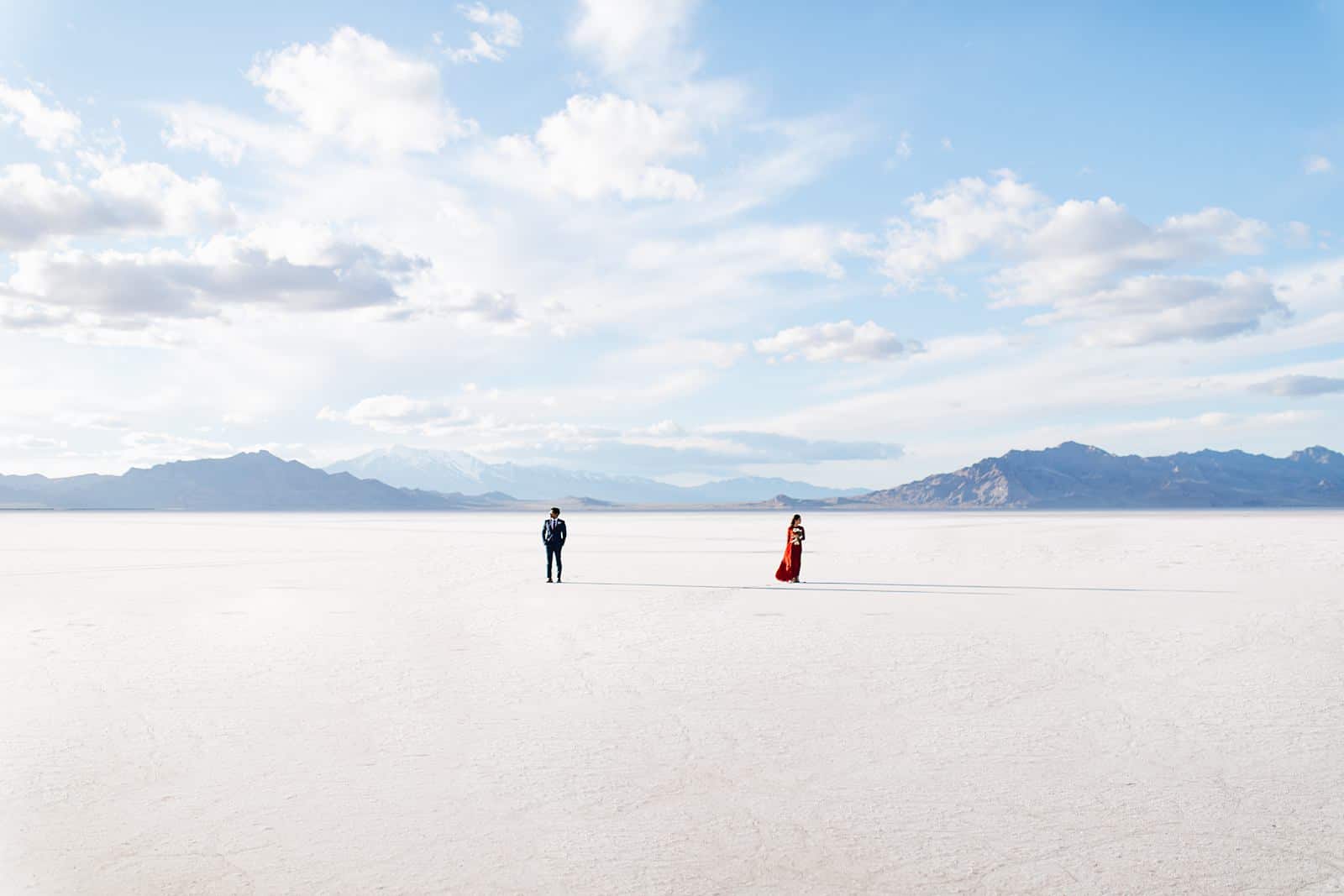 Bonneville Salt Flats Engagement Photos, Utah engagement session, engagement photography, red dress, clouds, water reflection, destination wedding