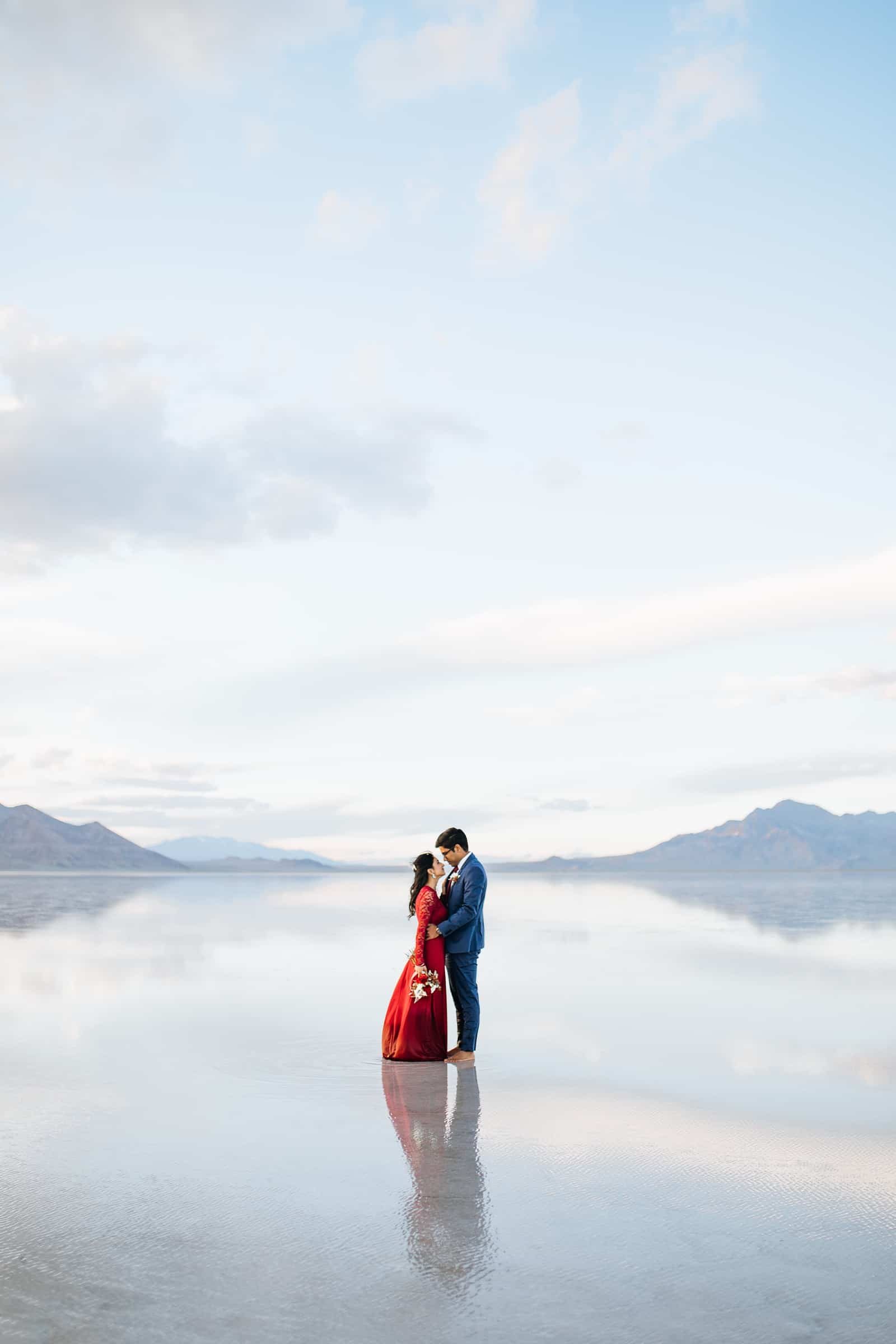 Bonneville Salt Flats Engagement Photos, Utah engagement session, engagement photography, red dress, clouds, water reflection, destination wedding