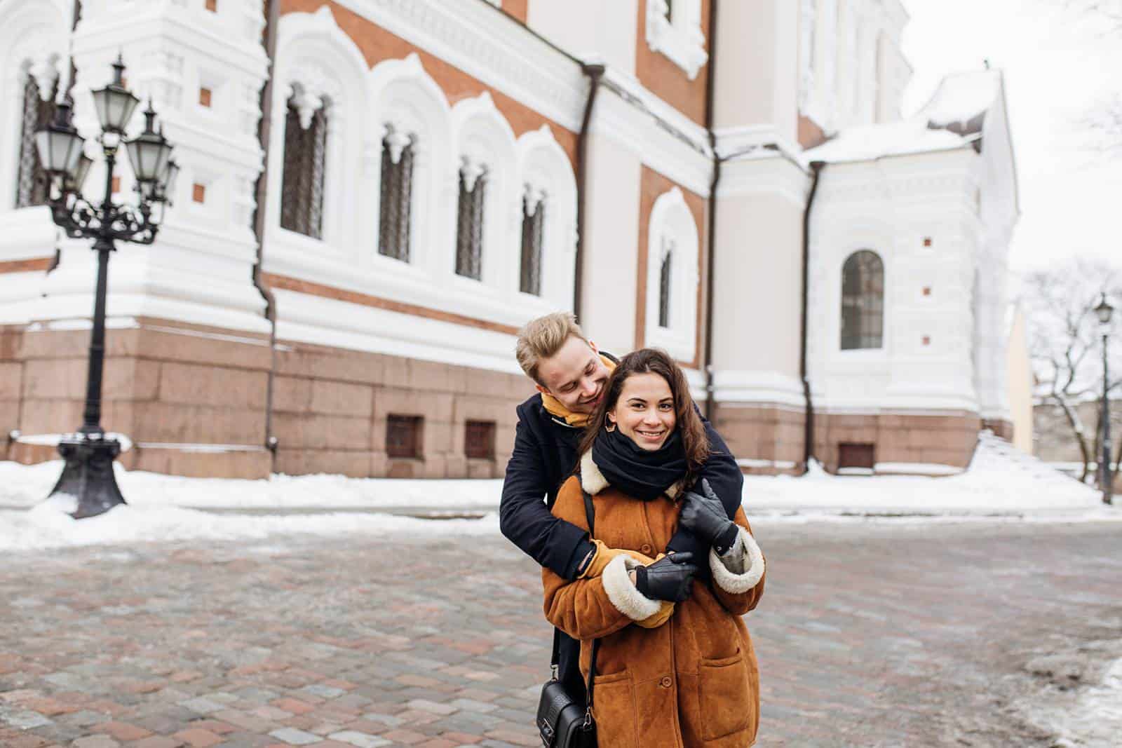 couple hugging, estonia engagement pictures, European city, travel photography