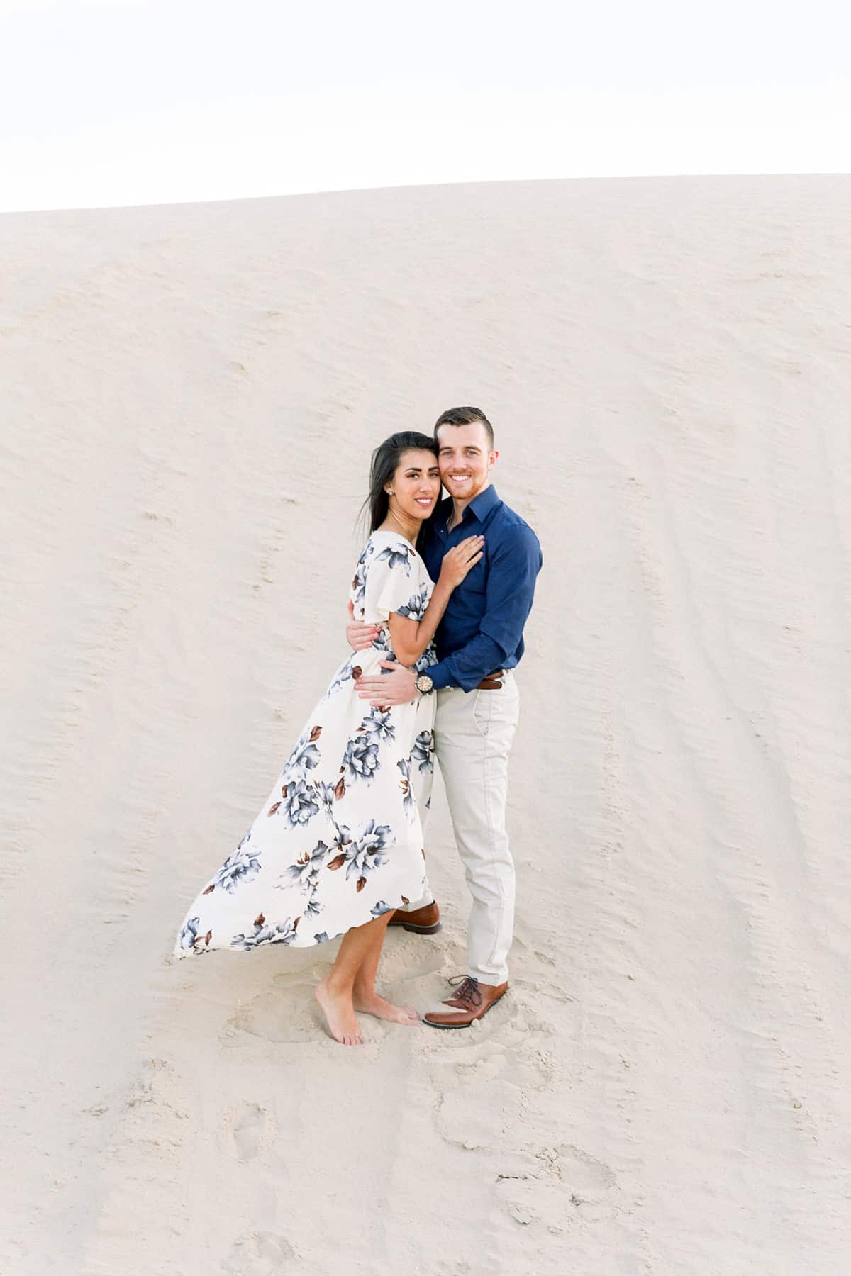 What to wear for engagement pictures, flowy floral dress, navy blue and white outfits