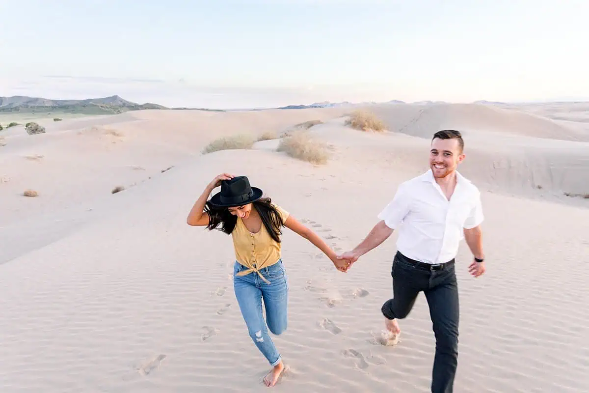 Little Sahara Sand Dunes Fun Engagement Photos at sunset, summer outfit, Utah desert photography