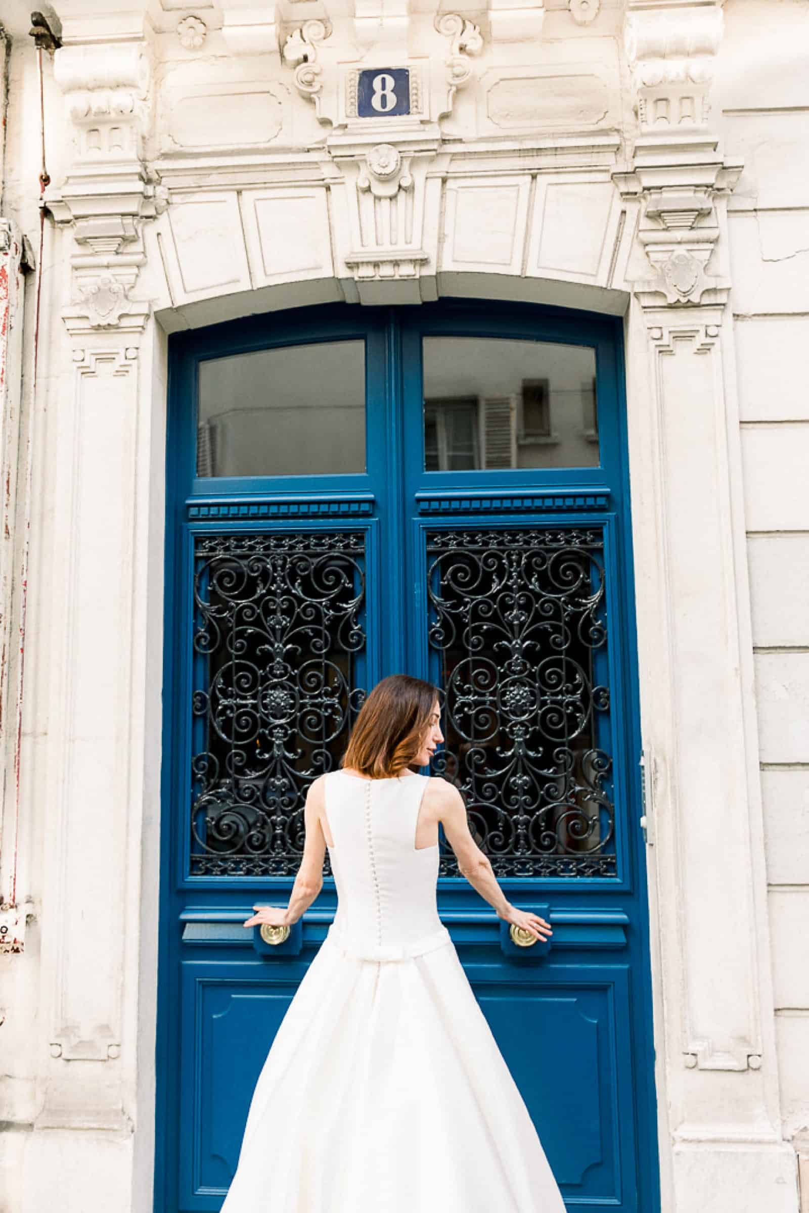 Modern bride in Paris, France with blue door