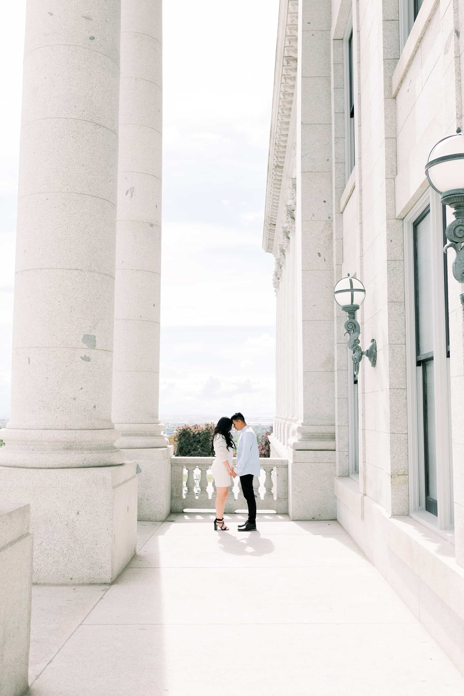 Classy engagement photos at the Utah State Capitol Building in downtown Salt Lake City, outfit for engagement pictures, short white lace dress and light blue button up shirt