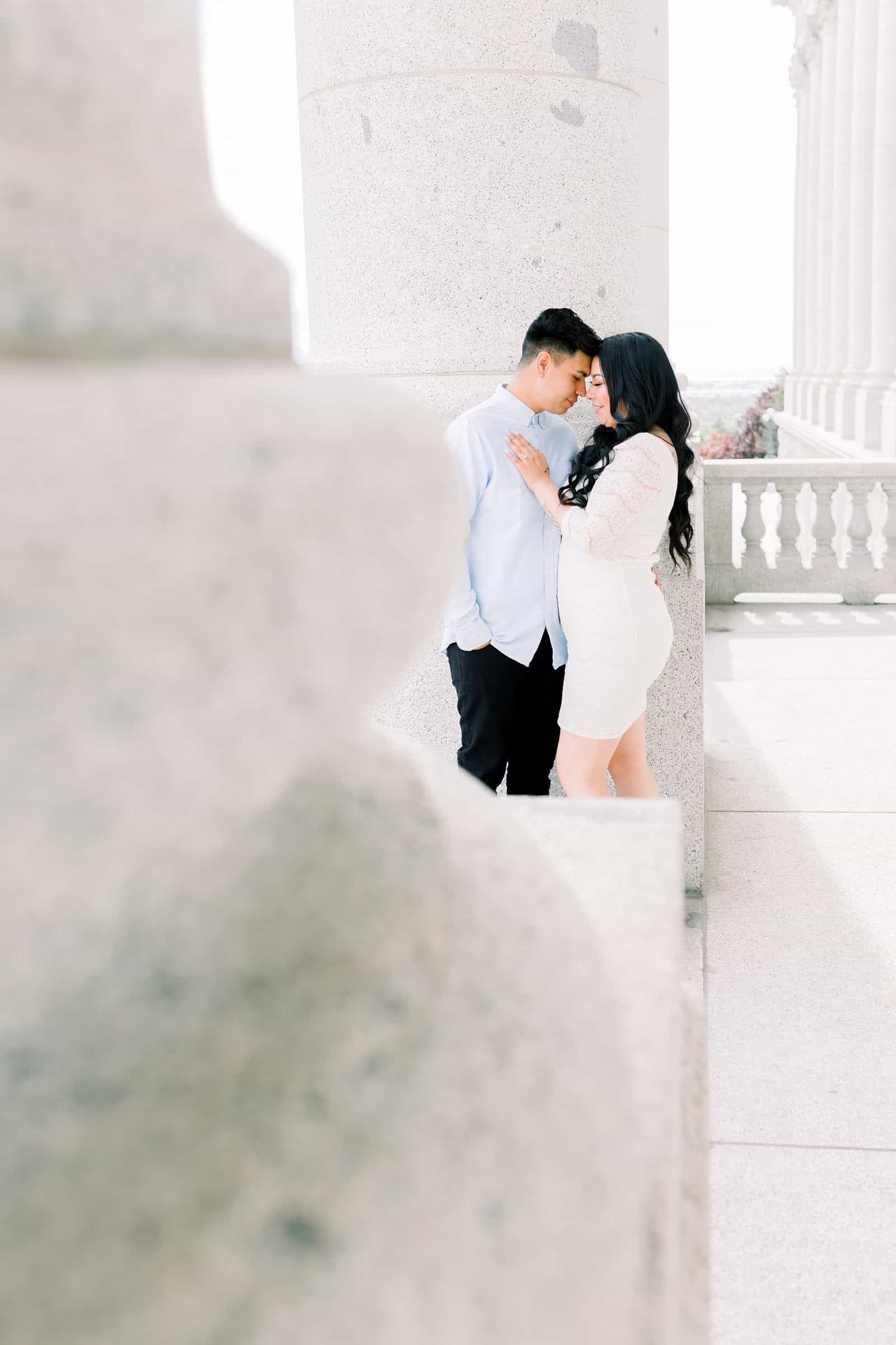 Classy engagement photos at the Utah State Capitol Building in downtown Salt Lake City, outfit for engagement pictures, short white lace dress and light blue button up shirt