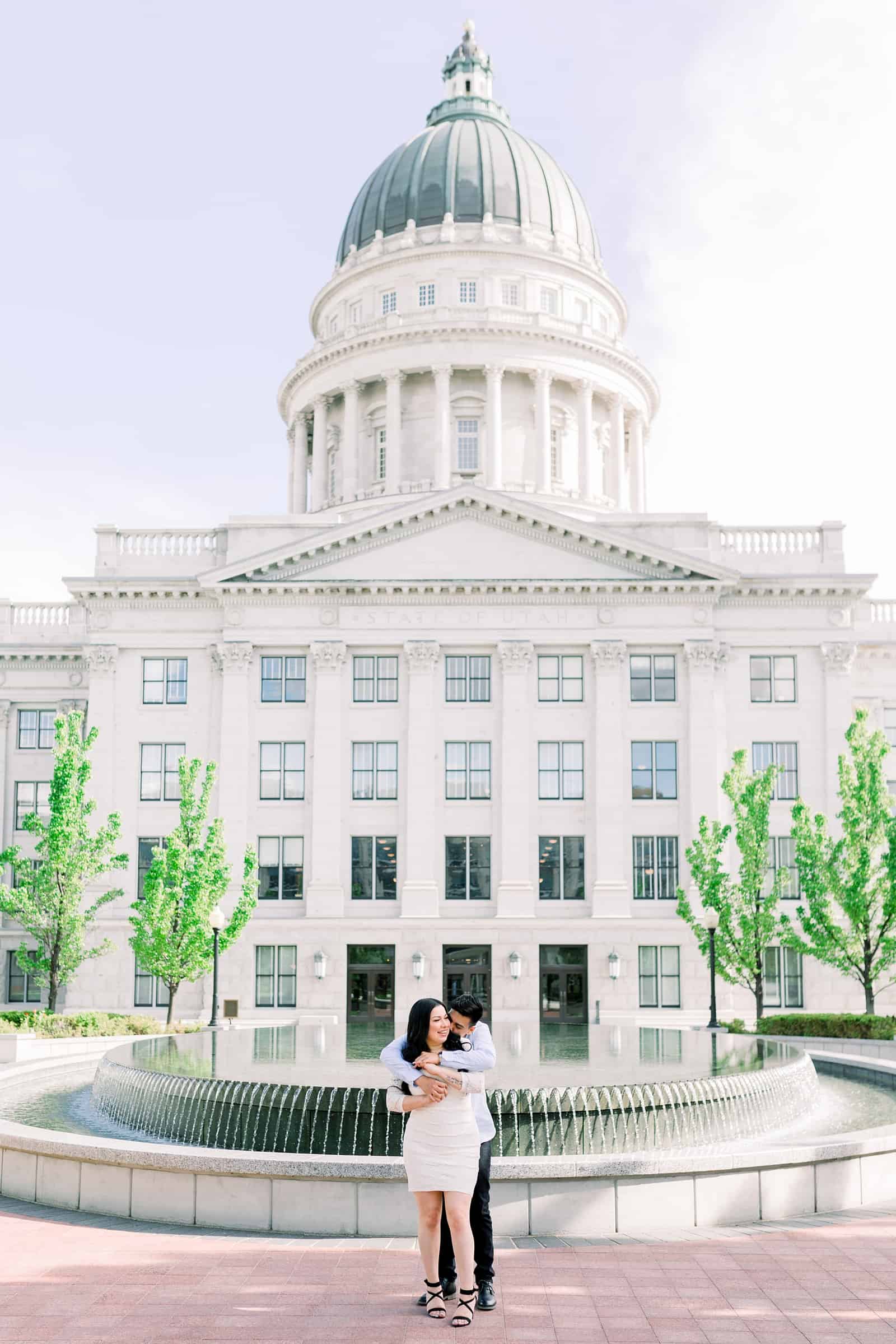 Classy engagement photos at the Utah State Capitol Building in downtown Salt Lake City, spring fountain pictures