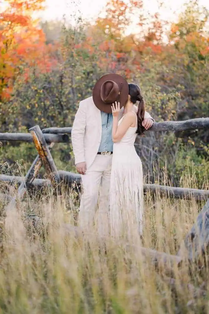 Bride and groom with wedding dress in utah mountains