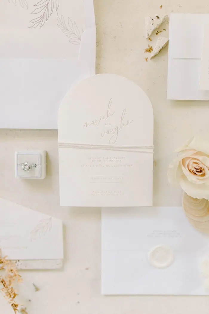 card invitation flatlay photos of wedding