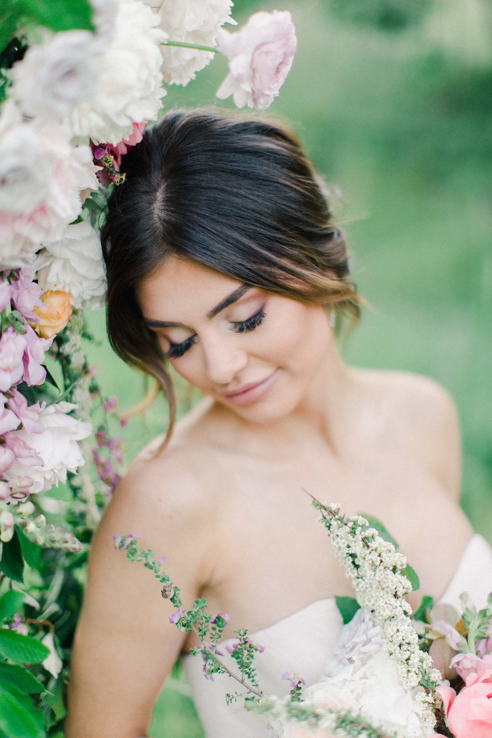 Outdoor Spring Secret Garden Wedding, Provo Utah Film Wedding Photography, floral arch wedding flowers, bride wearing BHLDN wedding dress with sweetheart neckline