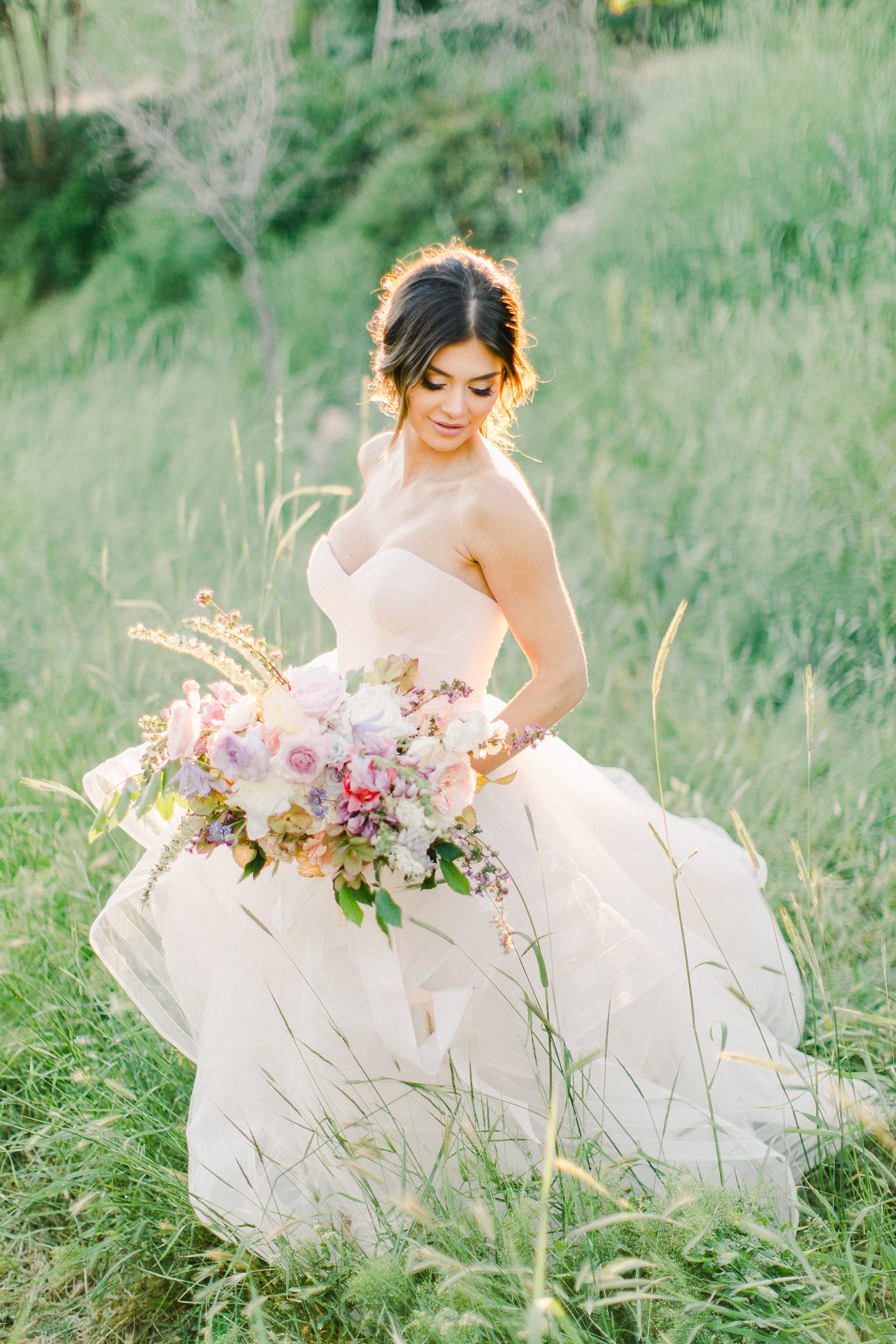 Outdoor Spring Secret Garden Wedding, Provo Utah Film Wedding Photography, pastel wildflower bouquet purple wedding flowers, bride wearing BHLDN wedding dress with sweetheart neckline