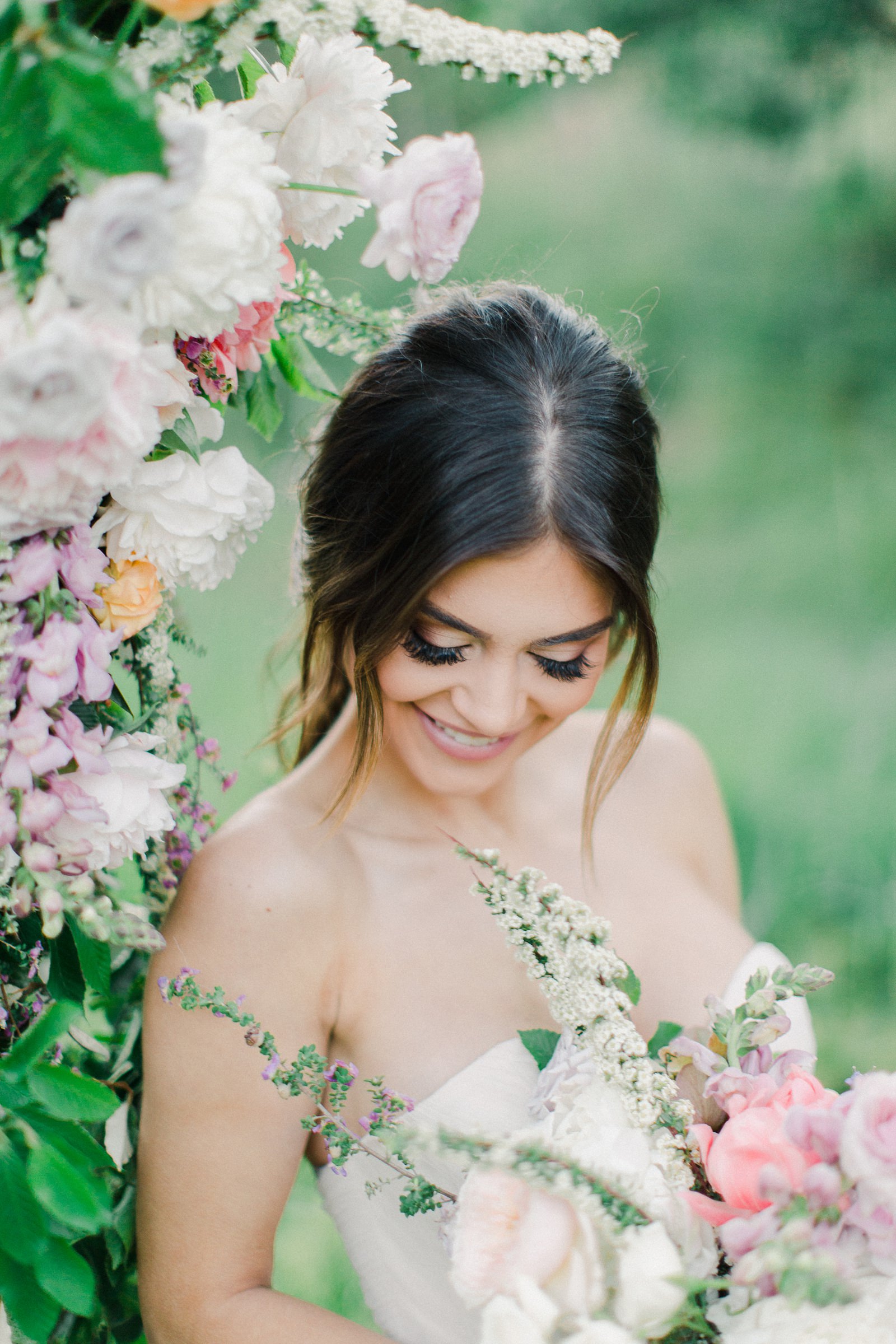 Outdoor Spring Secret Garden Wedding, Provo Utah Film Wedding Photography, floral arch wedding flowers, bride wearing BHLDN wedding dress with sweetheart neckline