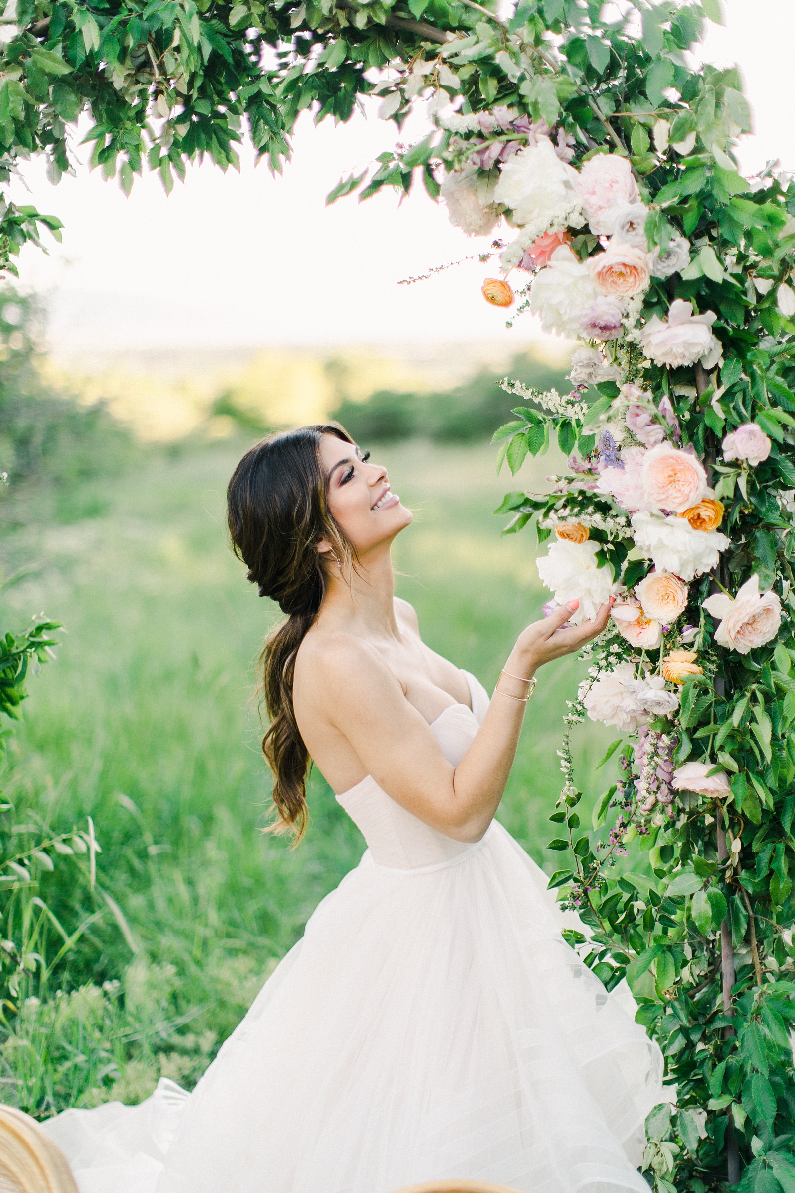 Outdoor Spring Secret Garden Wedding, Provo Utah Film Wedding Photography, floral arch wedding flowers, bride wearing BHLDN wedding dress with sweetheart neckline