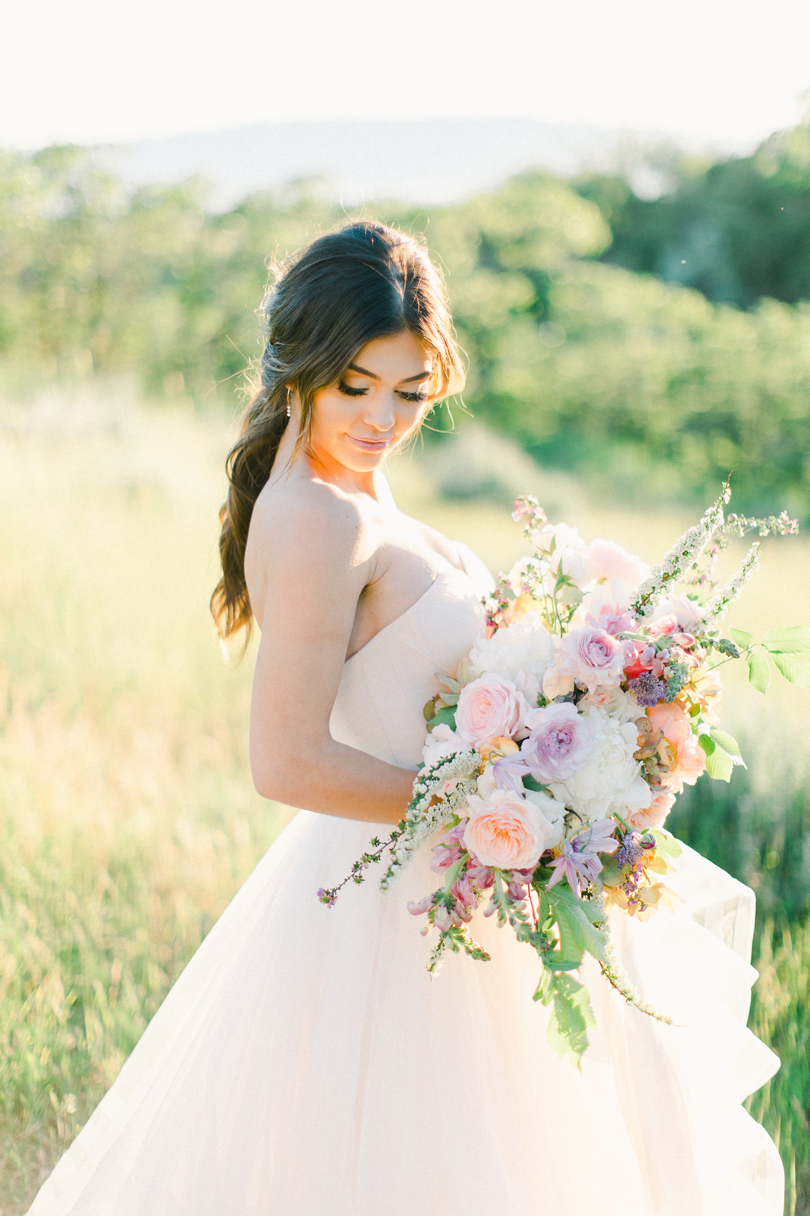 Outdoor Spring Secret Garden Wedding, Provo Utah Film Wedding Photography, pastel wildflower bouquet purple wedding flowers, bride wearing BHLDN wedding dress with sweetheart neckline