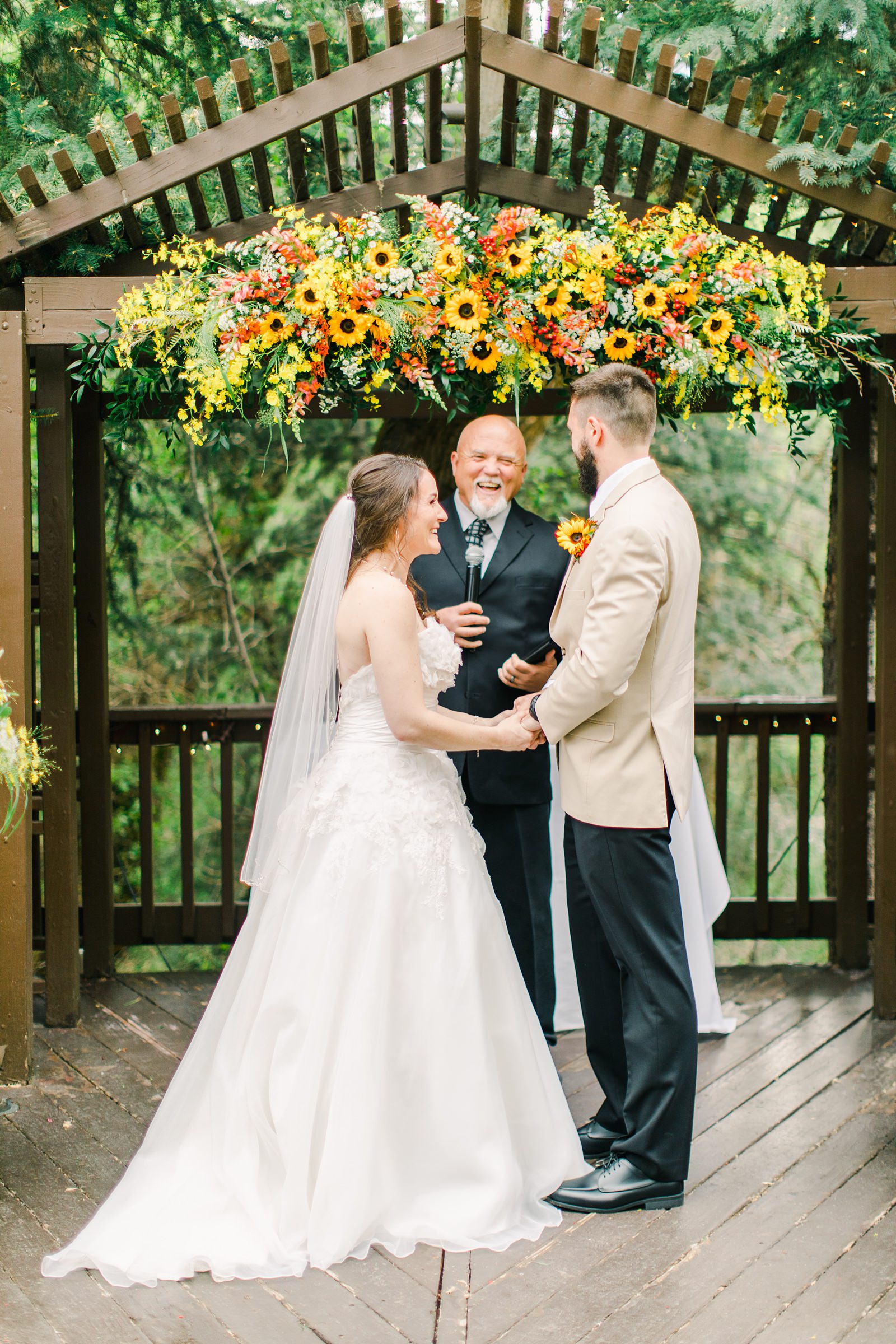 Millcreek Inn Summer Wedding, Utah wedding photography Millcreek Canyon, Salt Lake City, mountain ceremony, bride and groom under sunflower wildflower arch