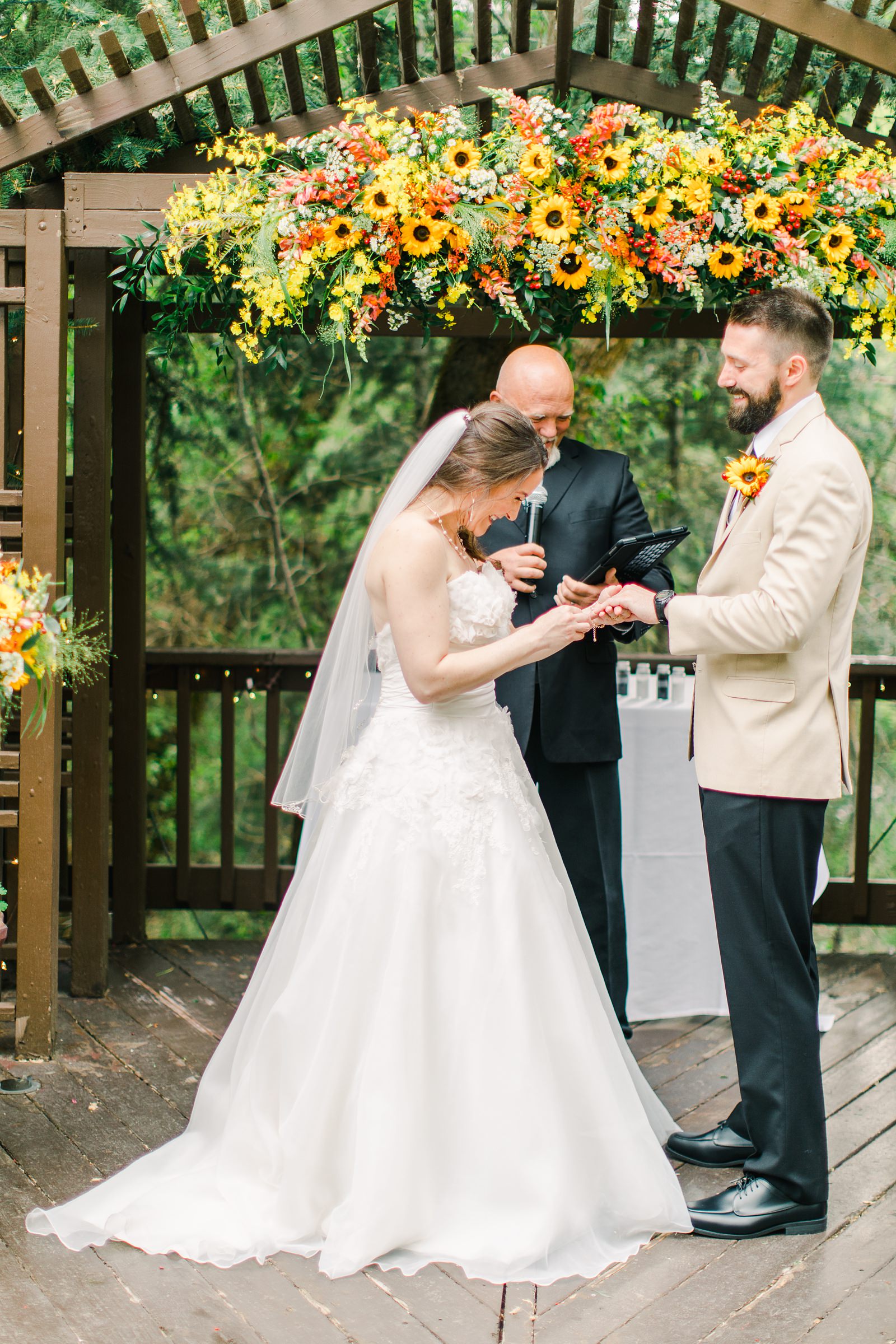 Millcreek Inn Summer Wedding, Utah wedding photography Millcreek Canyon, Salt Lake City, mountain ceremony, bride and groom under sunflower wildflower arch