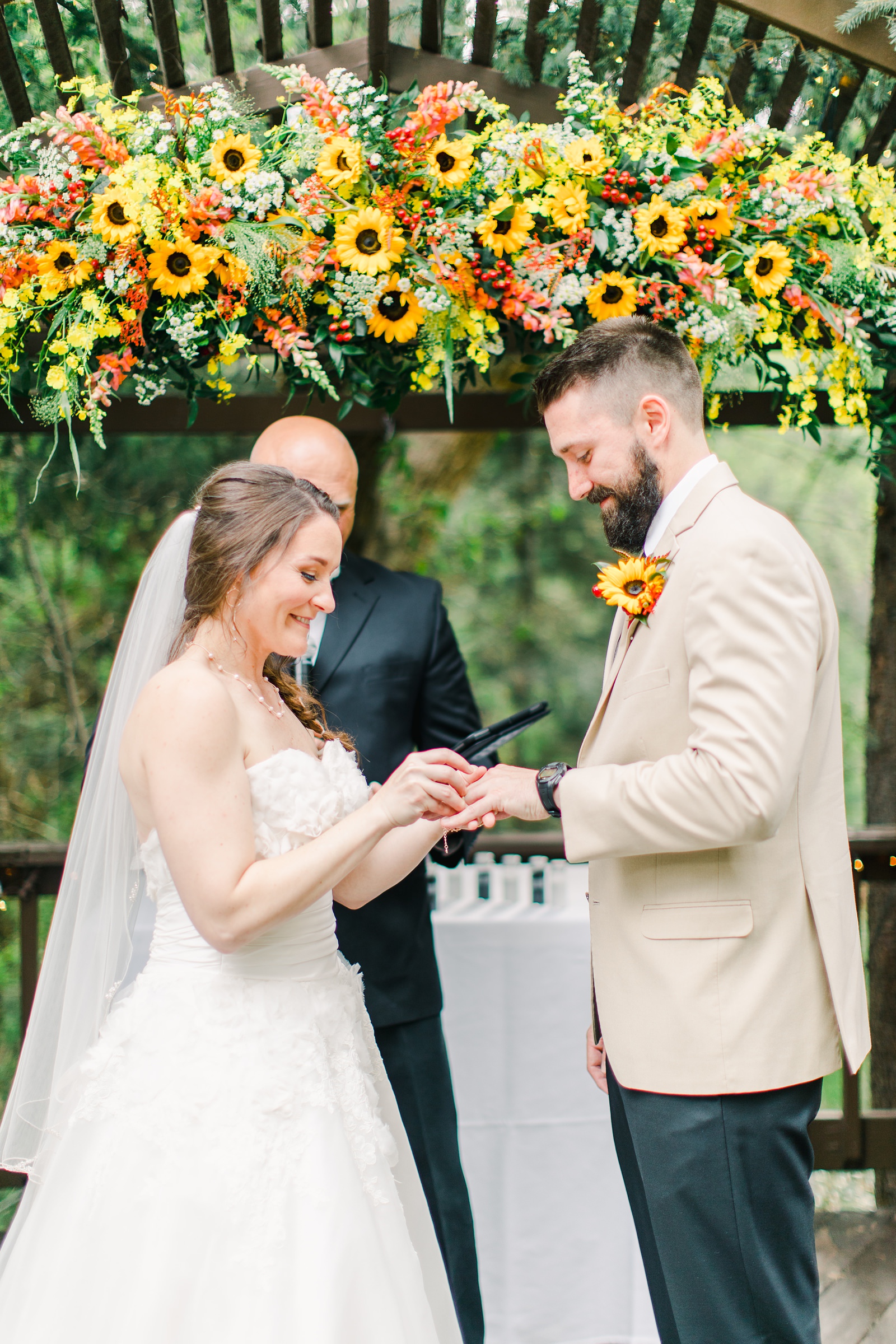 Millcreek Inn Summer Wedding, Utah wedding photography Millcreek Canyon, Salt Lake City, mountain ceremony, bride and groom under sunflower wildflower arch