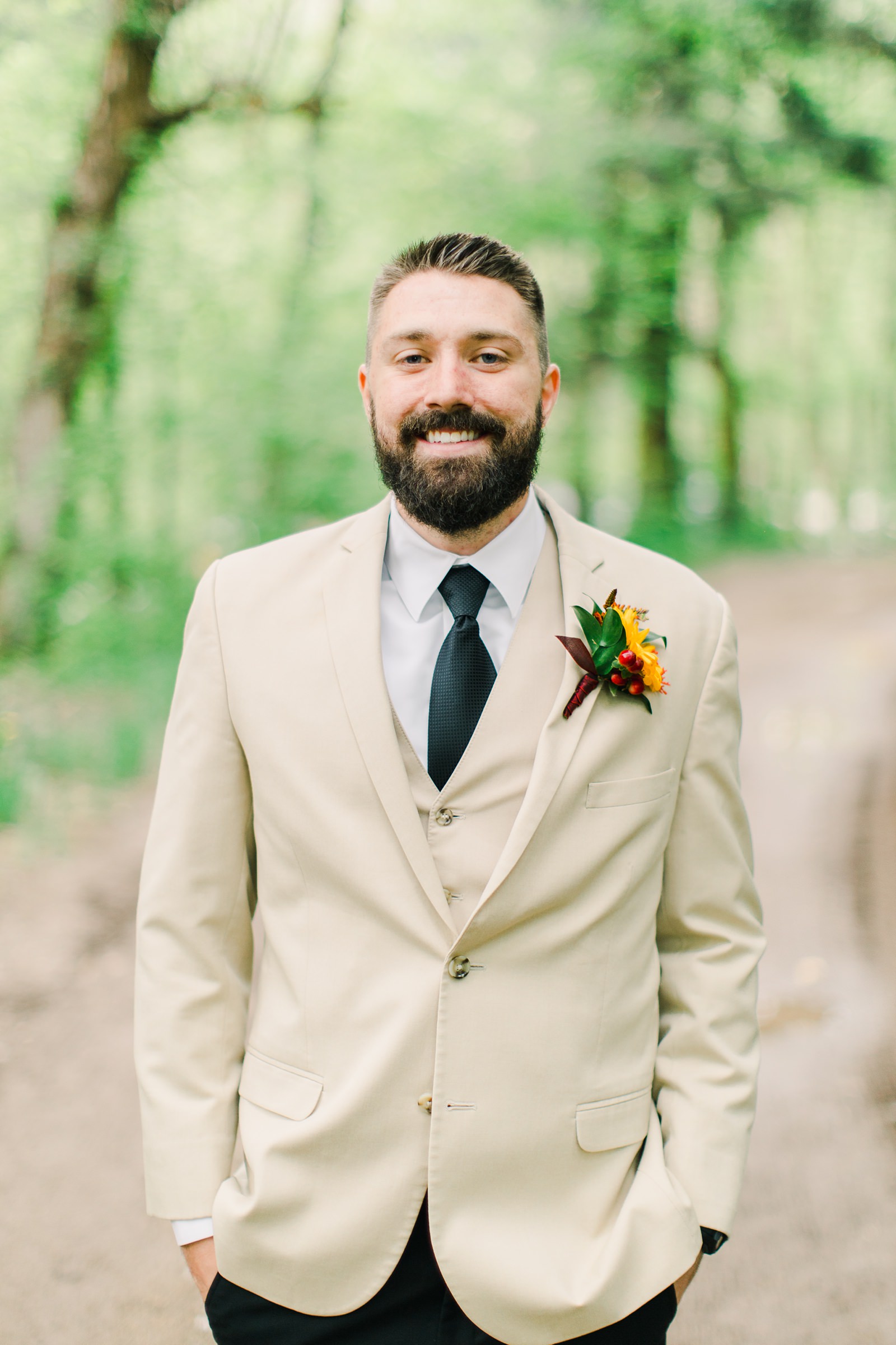 Millcreek Inn Summer Wedding, Utah wedding photography Millcreek Canyon, Salt Lake City, groom in suit with tan jacket and black pants, navy tie,