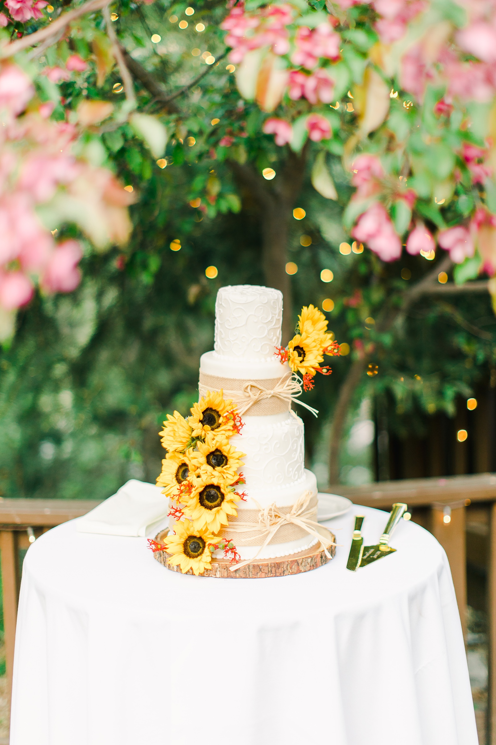 Millcreek Inn Summer Wedding, Utah wedding photography Millcreek Canyon, Salt Lake City, three tier white buttercream wedding cake with sunflowers