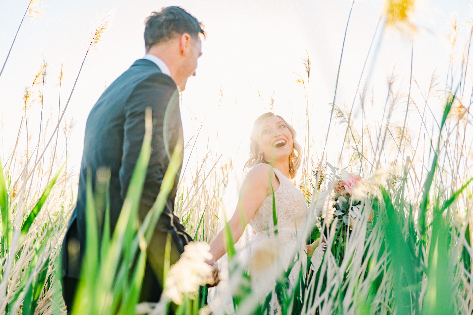 Salt Lake City Utah Bridal Wedding Photography, Tunnel Springs Park, bride and groom in long grasses cattails golden sunset light