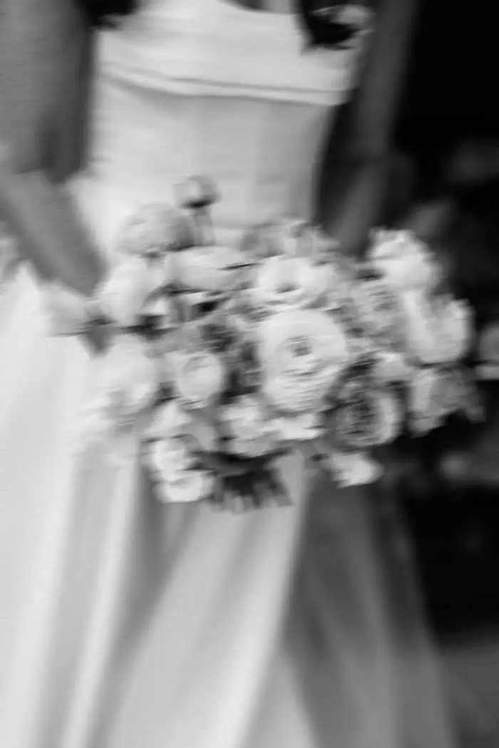 Elegant wedding bouquet held by bride in a wedding dress.