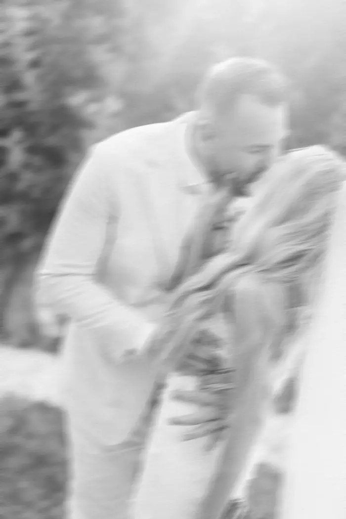Portrait of a couple sharing a tender moment outdoors.