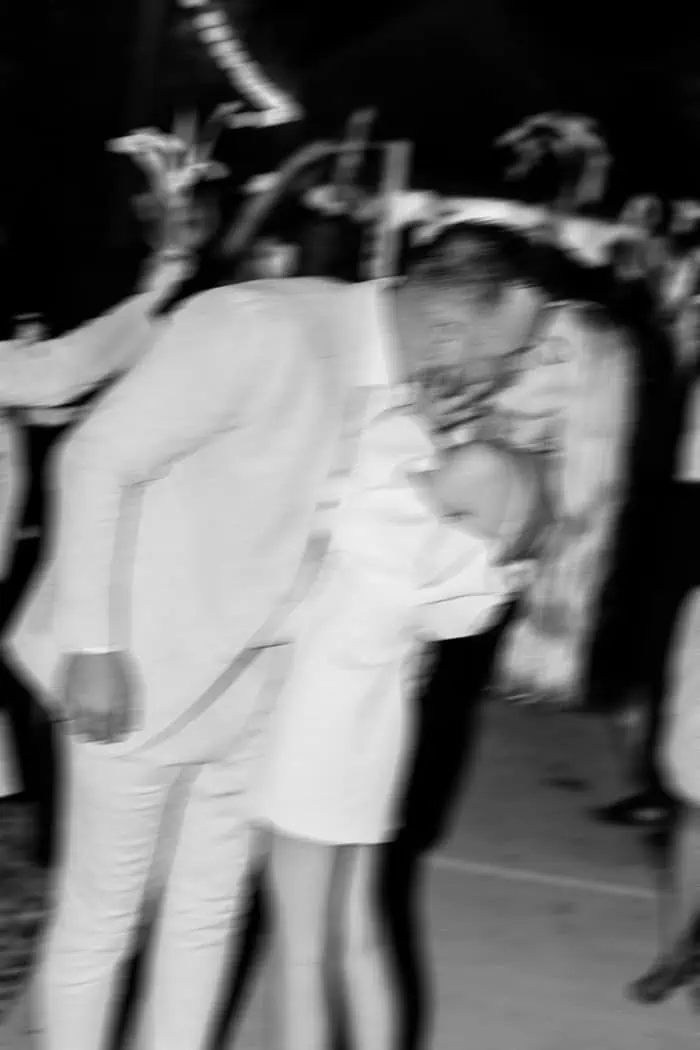 Man and child sharing a joyful moment at a celebration event.