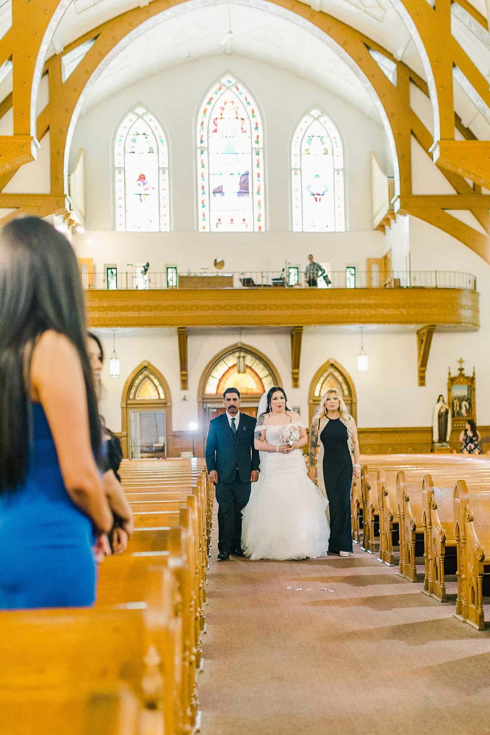 Cache Valley Logan Traditional Catholic Wedding Ceremony in a cathedral, Utah wedding photography, bride walks down the aisle