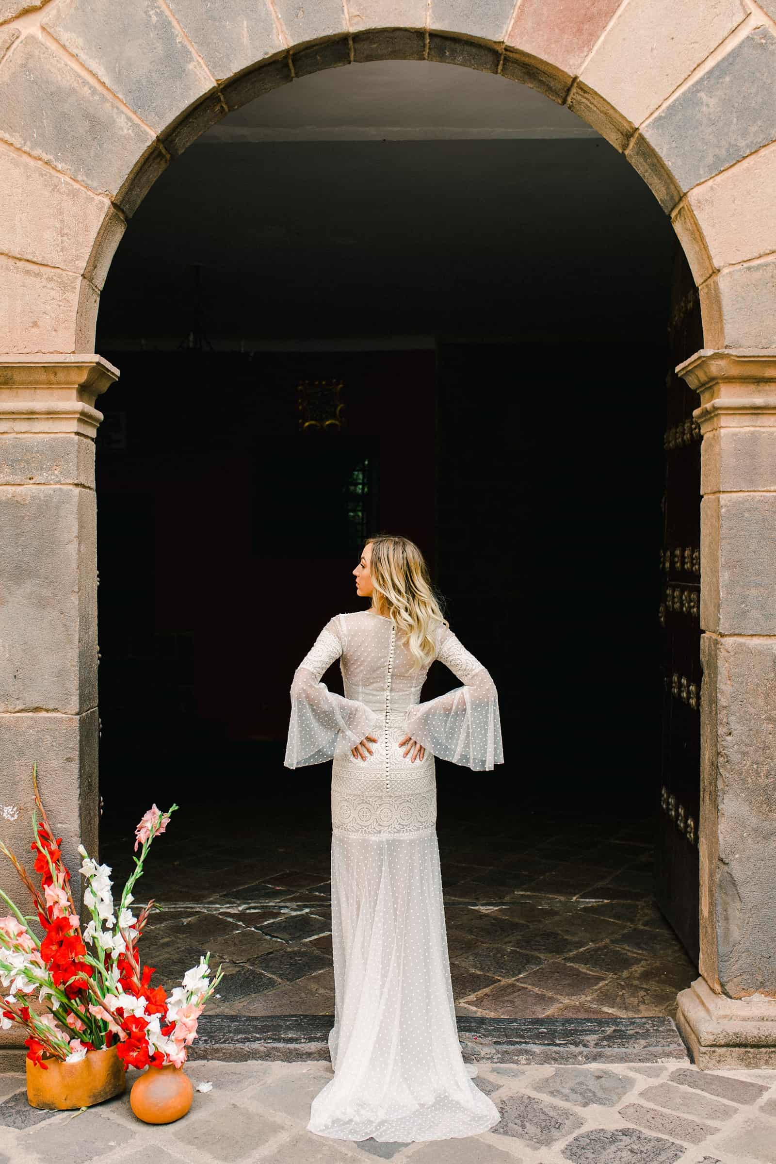 Cusco Peru Destination Wedding, travel wedding photography, boho bride lace dress with bell sleeves