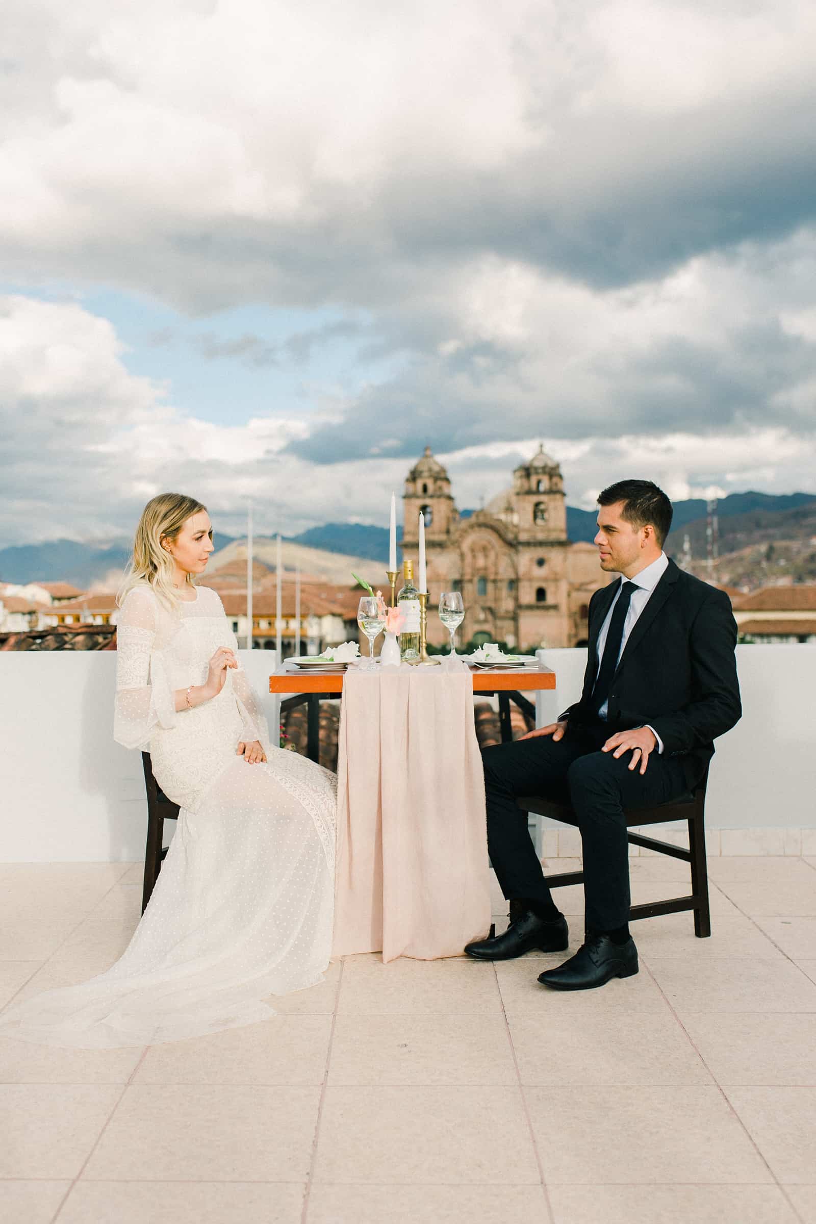 Cusco Peru Destination Wedding Inspiration, travel photography, bride and groom wedding dinner overlooking Cusco Cathedral