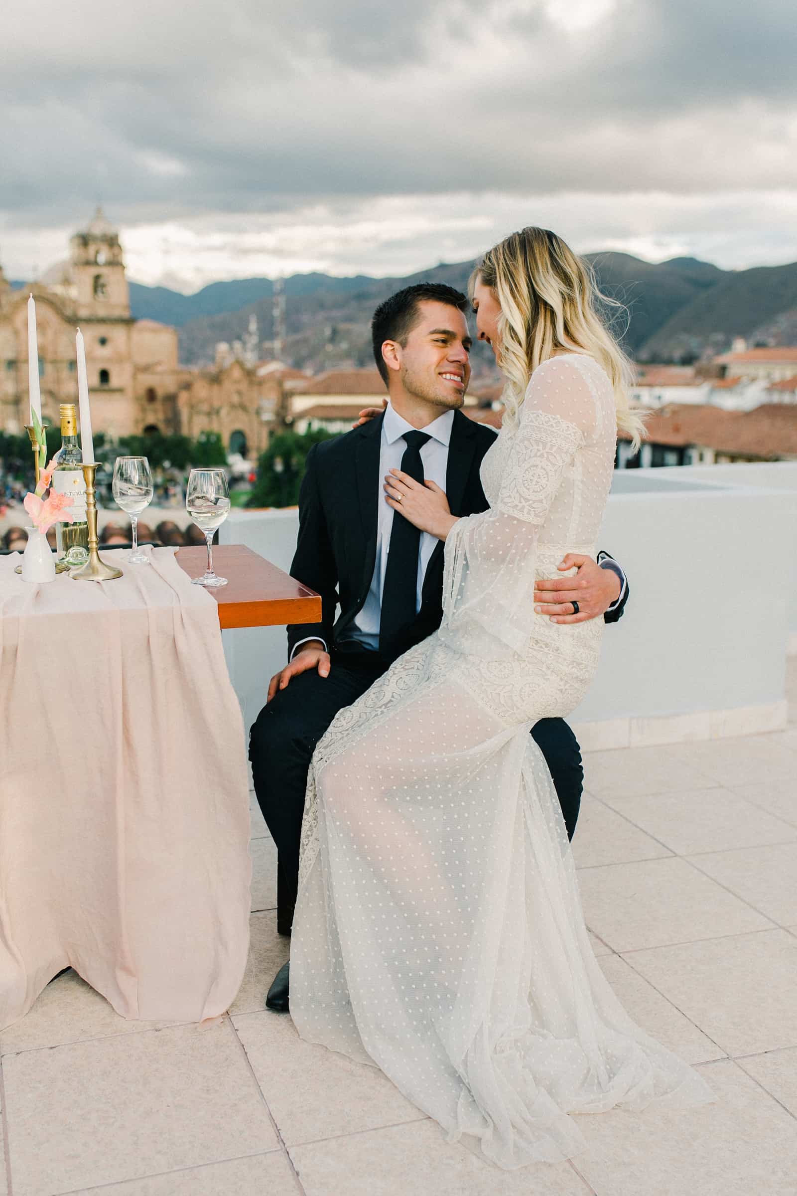 Cusco Peru Destination Wedding Inspiration, travel photography, bride and groom wedding dinner overlooking Cusco Cathedral