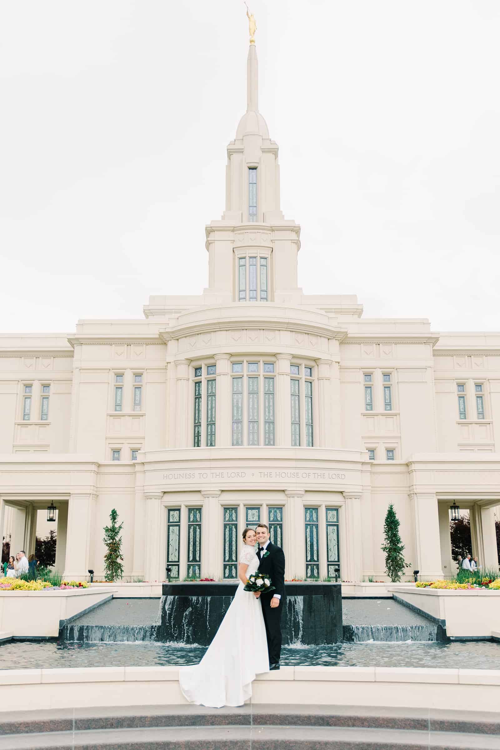 Payson Utah Temple wedding, bride and groom near fountain