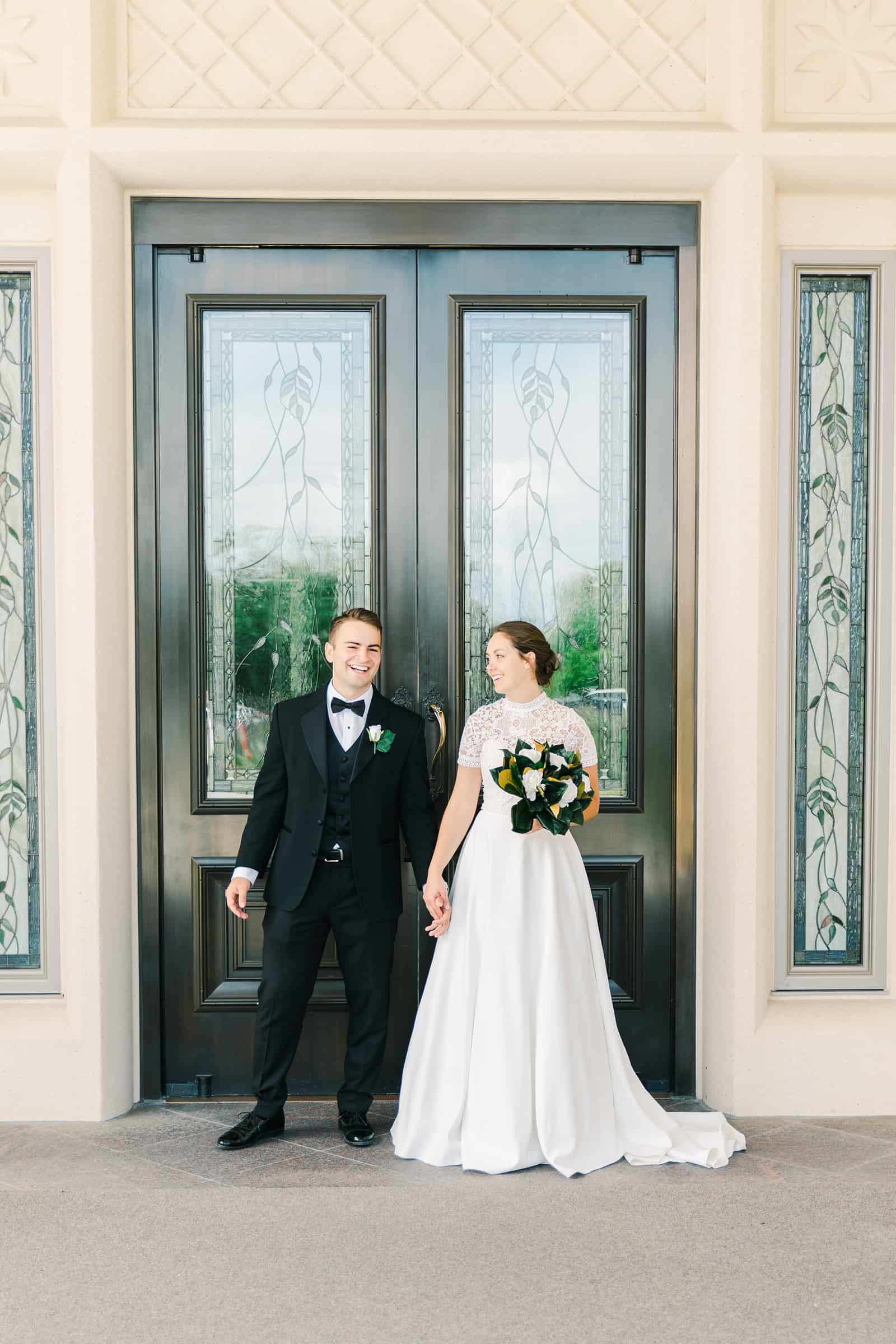 Payson Utah Temple wedding, bride and groom near temple doors