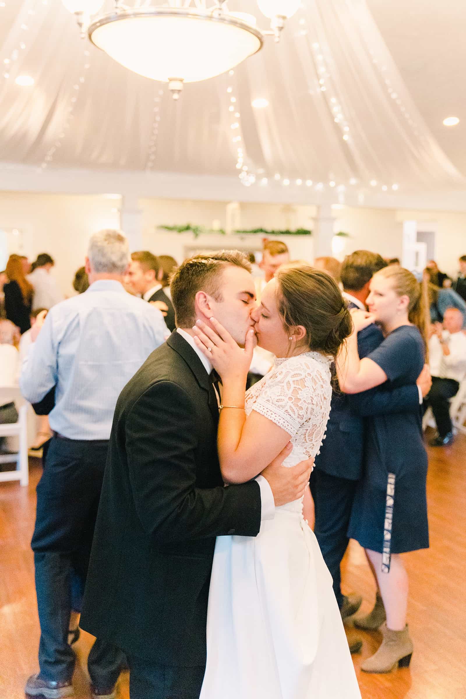 Clarion Gardens Payson Utah Wedding, bride and groom first dance kiss