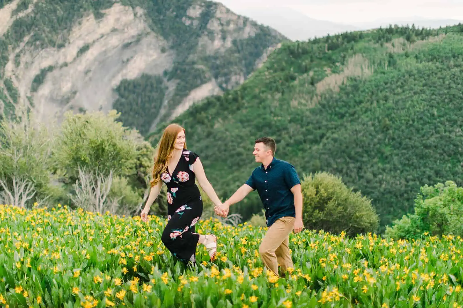 Provo Canyon wildflowers field engagement session, Utah wedding photography, engaged couple walking through the yellow flowers