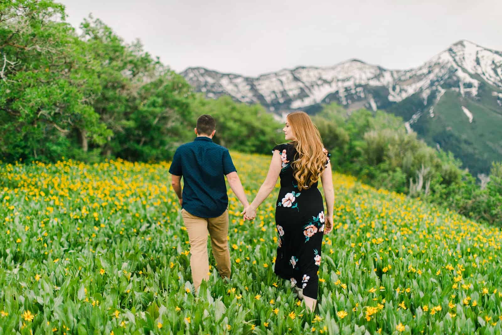 Provo Canyon wildflowers field engagement session, Utah wedding photography, engaged couple walking through the yellow flowers