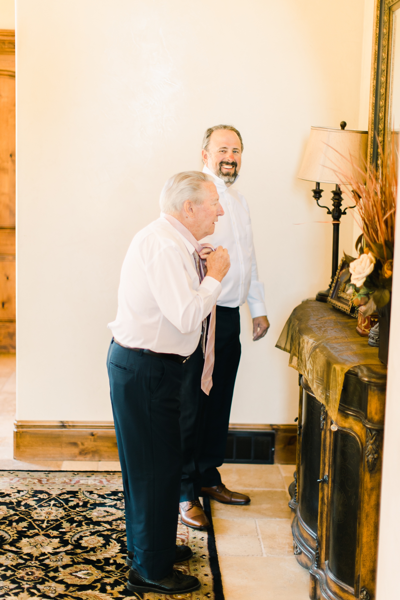 father of the bride and grandfather getting ready for wedding ceremony