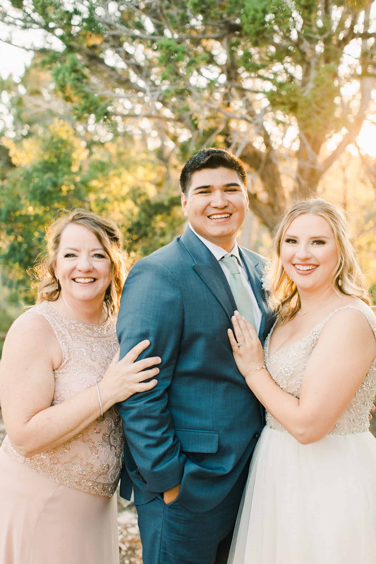 bride and groom with mother of the bride