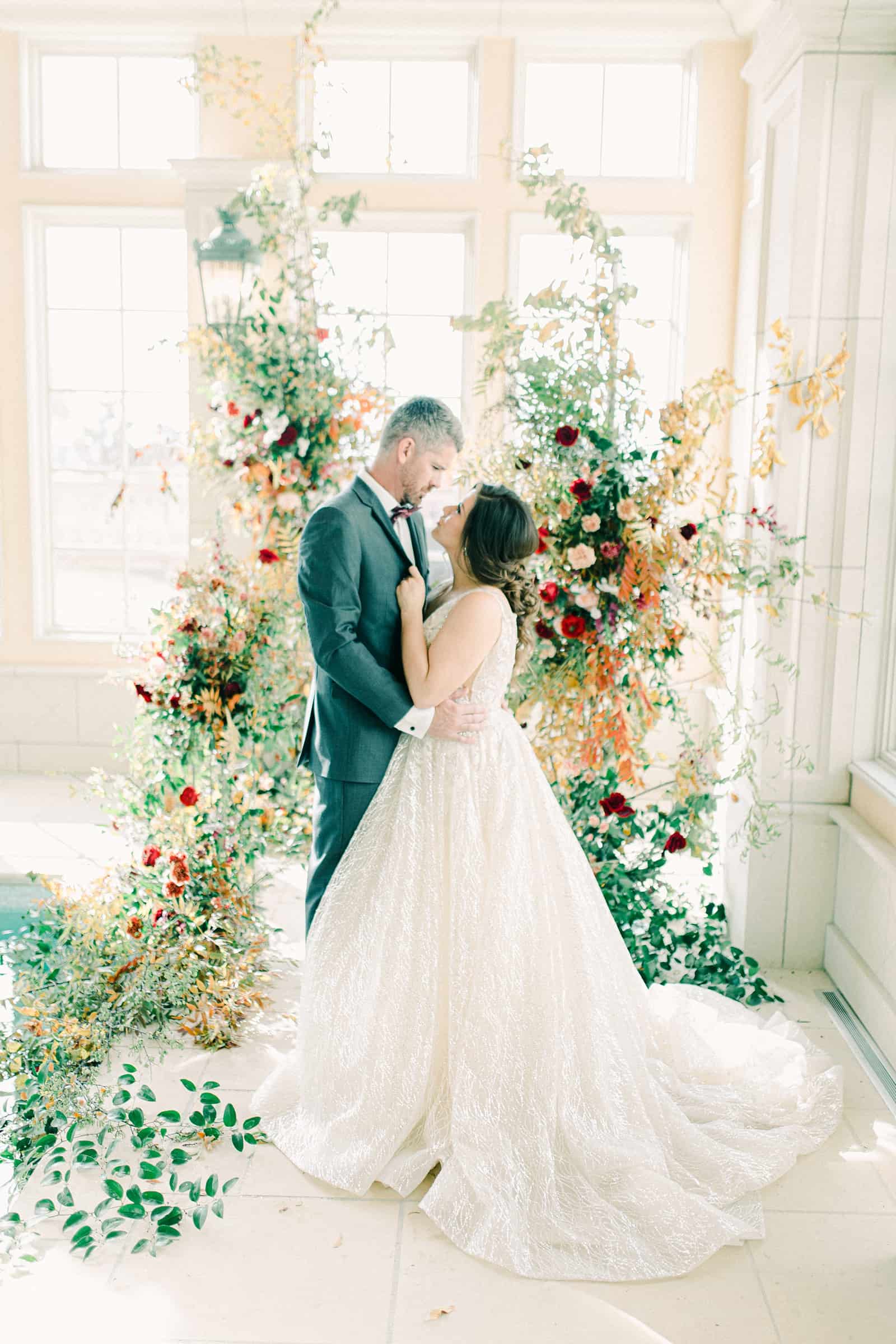 French-inspired wedding at the Olana mansion in Dallas, Texas, bride and groom with ceremony backdrop