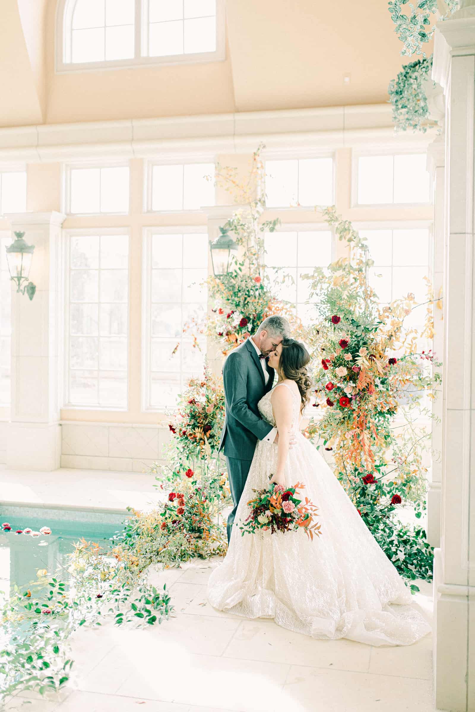 French-inspired wedding at the Olana mansion in Dallas, Texas, pool house ceremony, bride and groom with ceremony backdrop