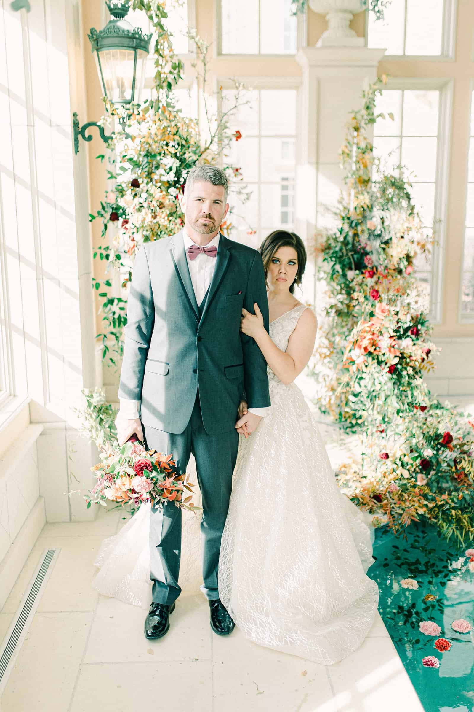 French-inspired wedding at the Olana mansion in Dallas, Texas, bride and groom with ceremony backdrop