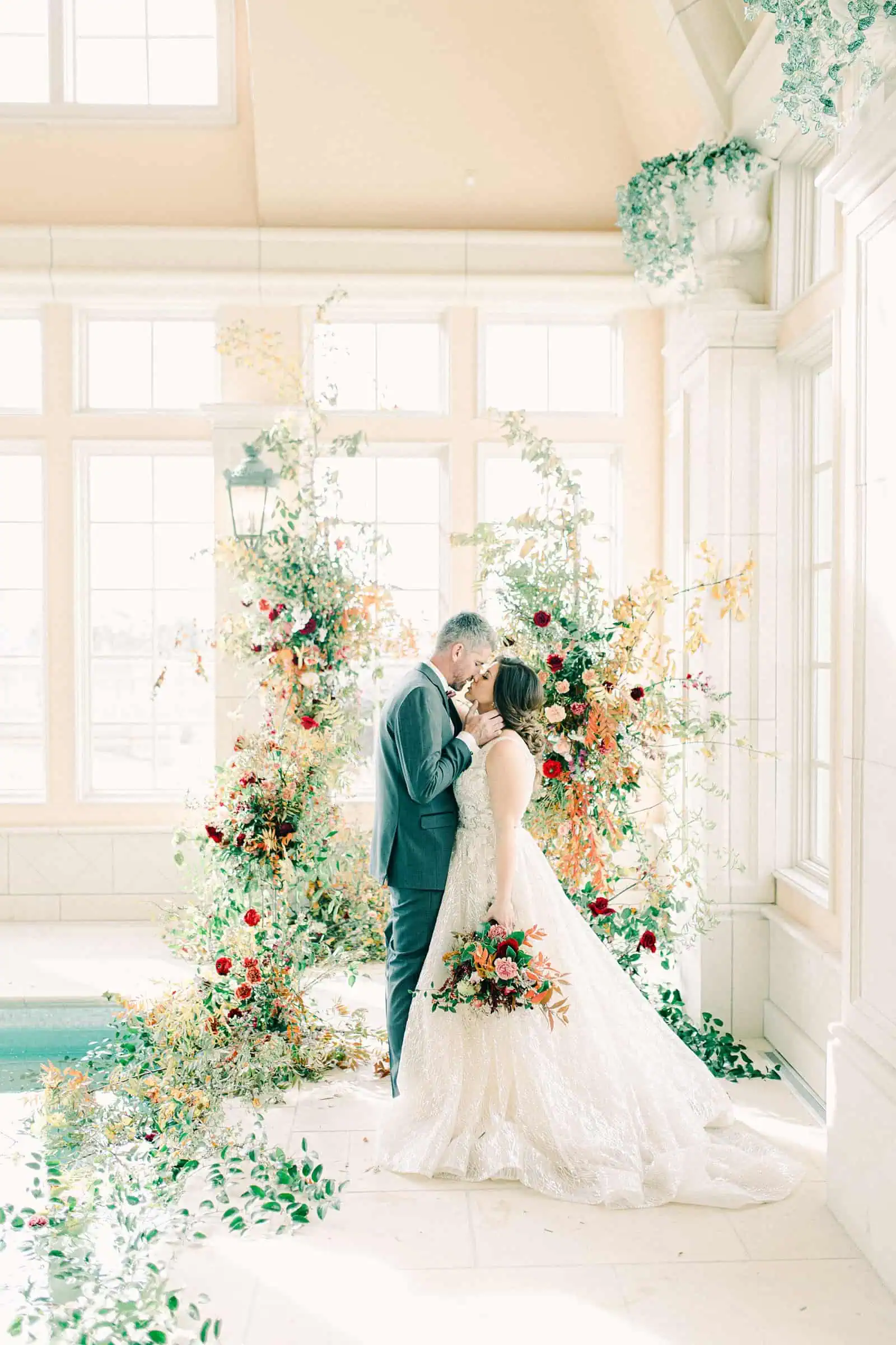 French-inspired wedding at the Olana mansion in Dallas, Texas, pool house ceremony, bride and groom with ceremony backdrop