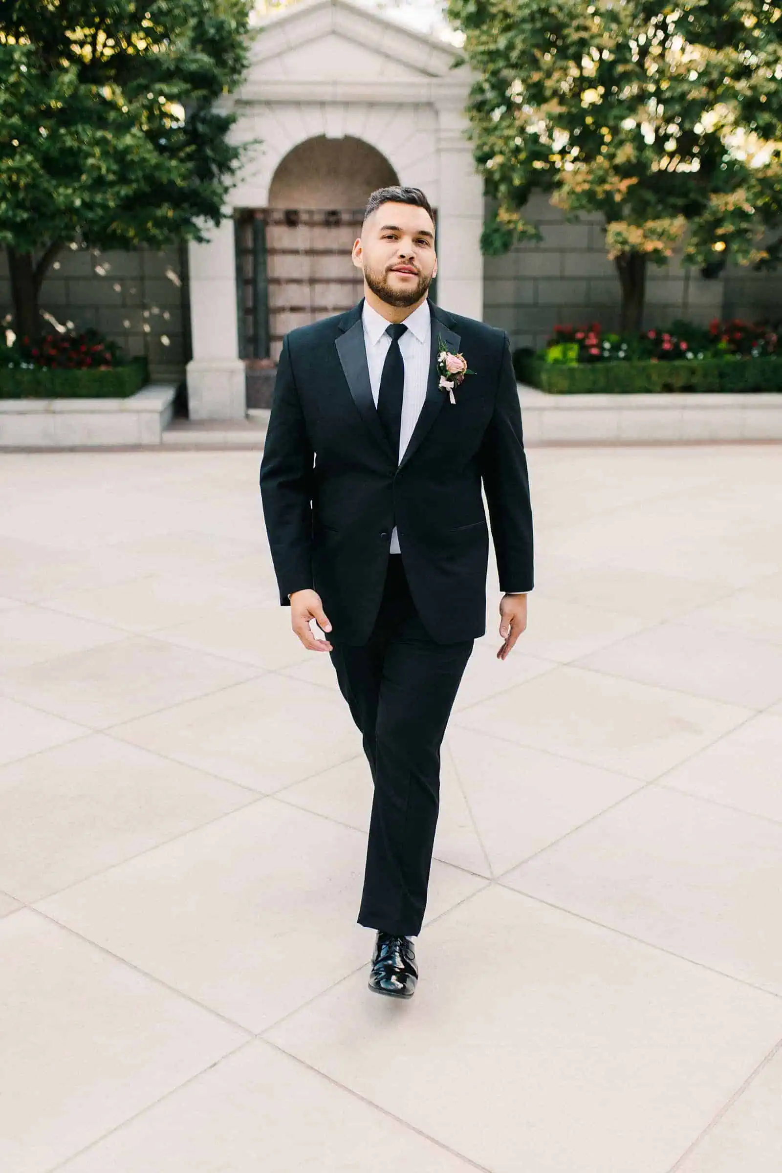 Groom wearing classic black tuxedo