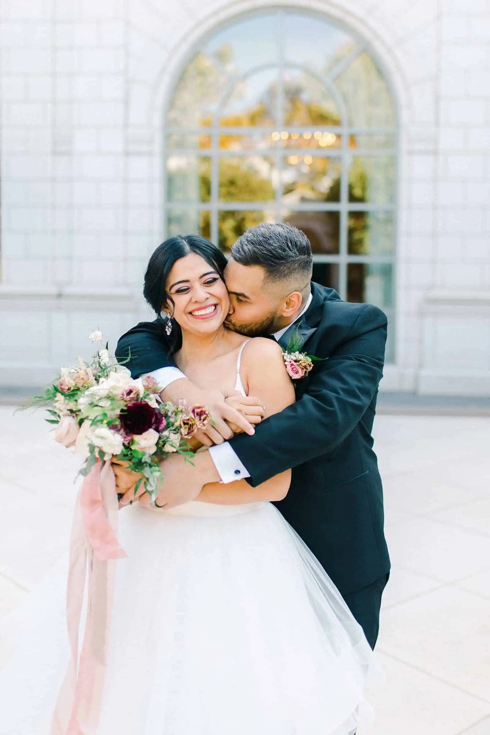 Bride and groom share a sweet moment together on their wedding day