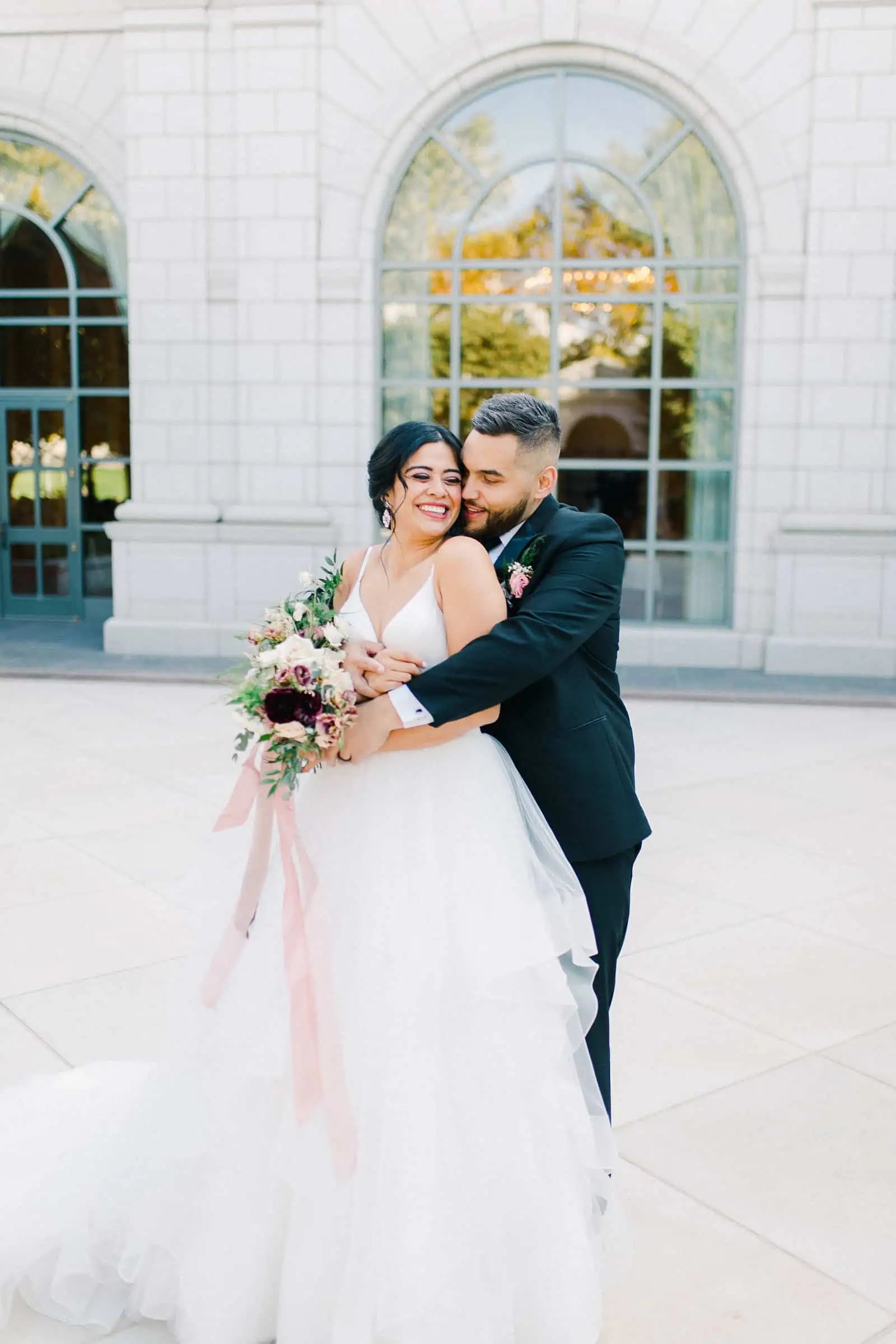 Bride and groom share a sweet moment together on their wedding day