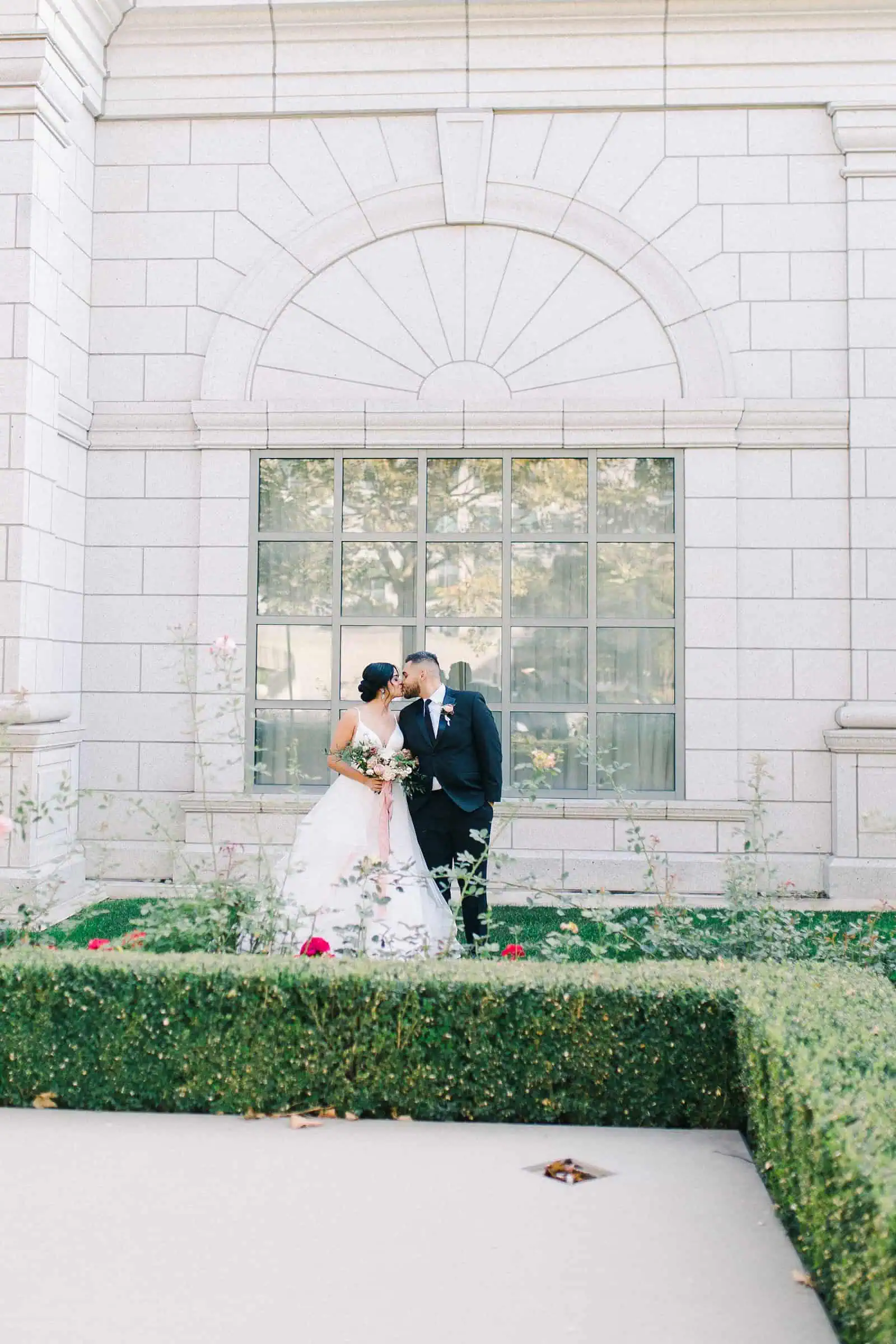 Grand America Hotel wedding, bride and groom in garden with roses, summer wedding