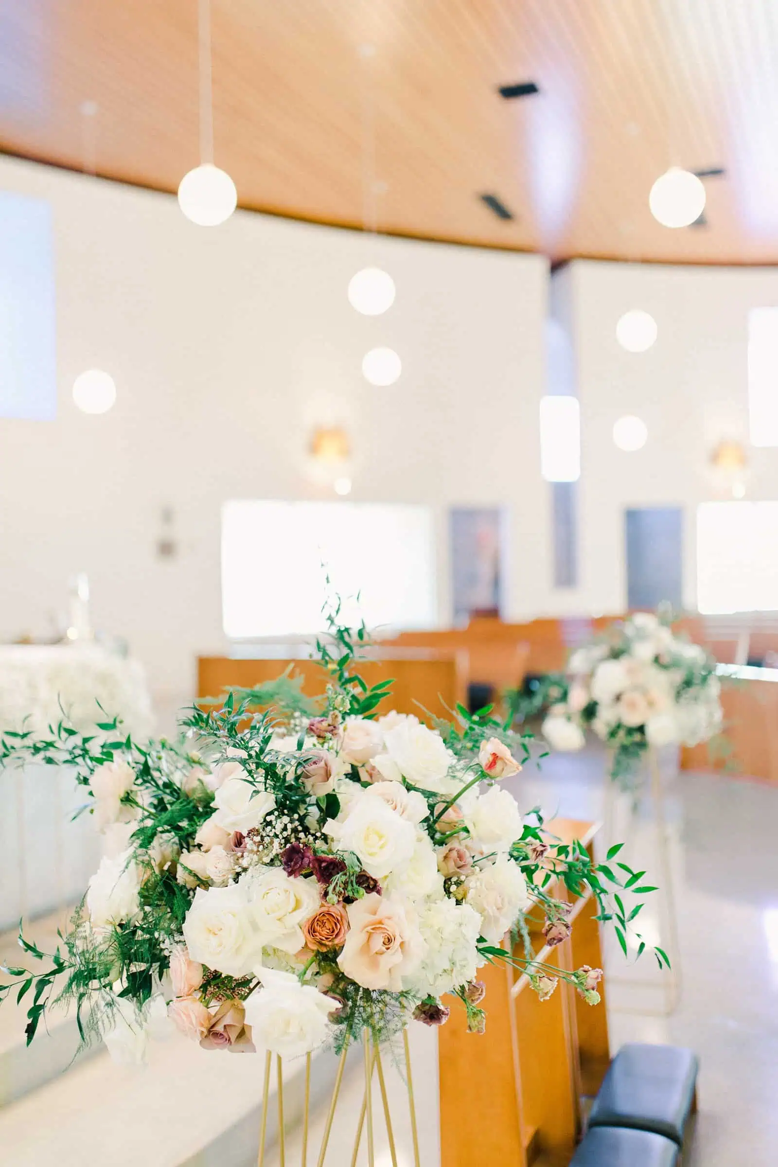 Church wedding with rose centerpieces arrangements