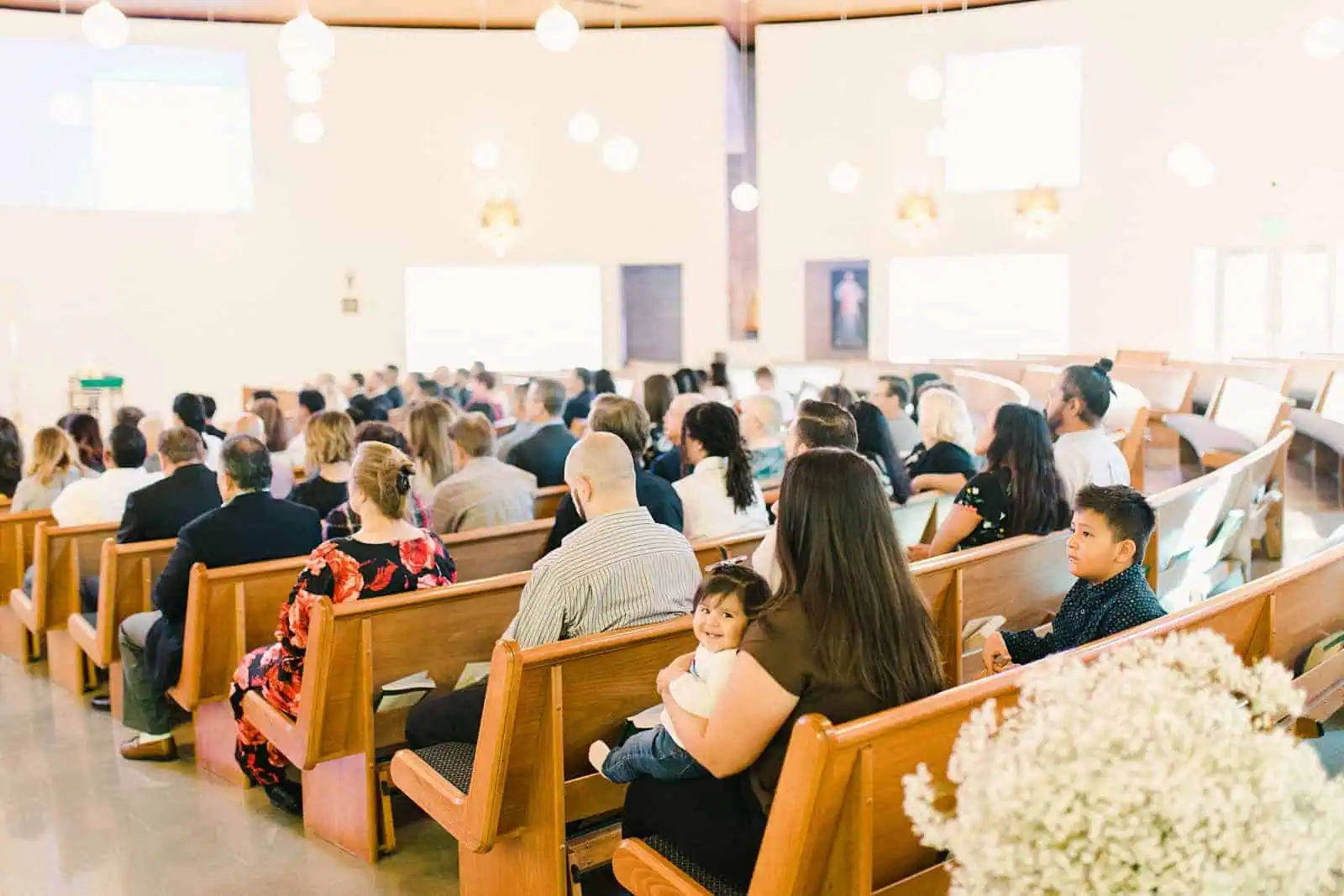 Guests enjoy catholic mass and wedding ceremony