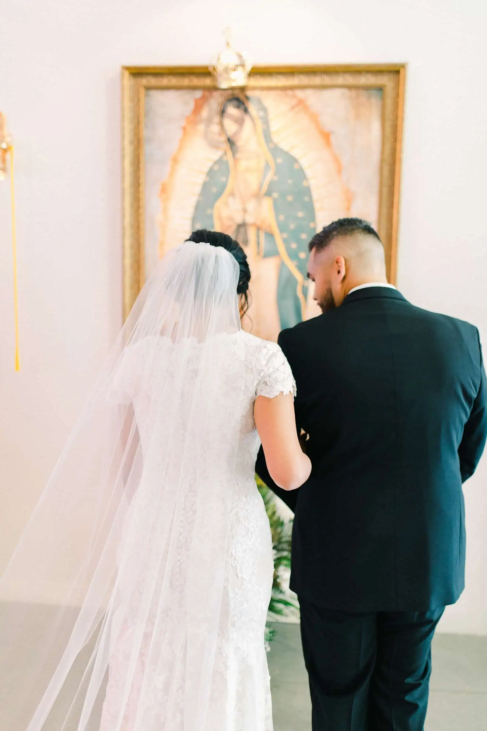 Bride and groom walk out of church together after wedding ceremony